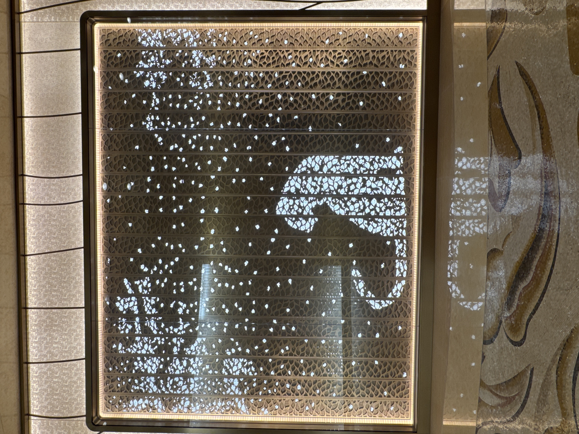 Illuminated elephant motif panel observed in Macao interior