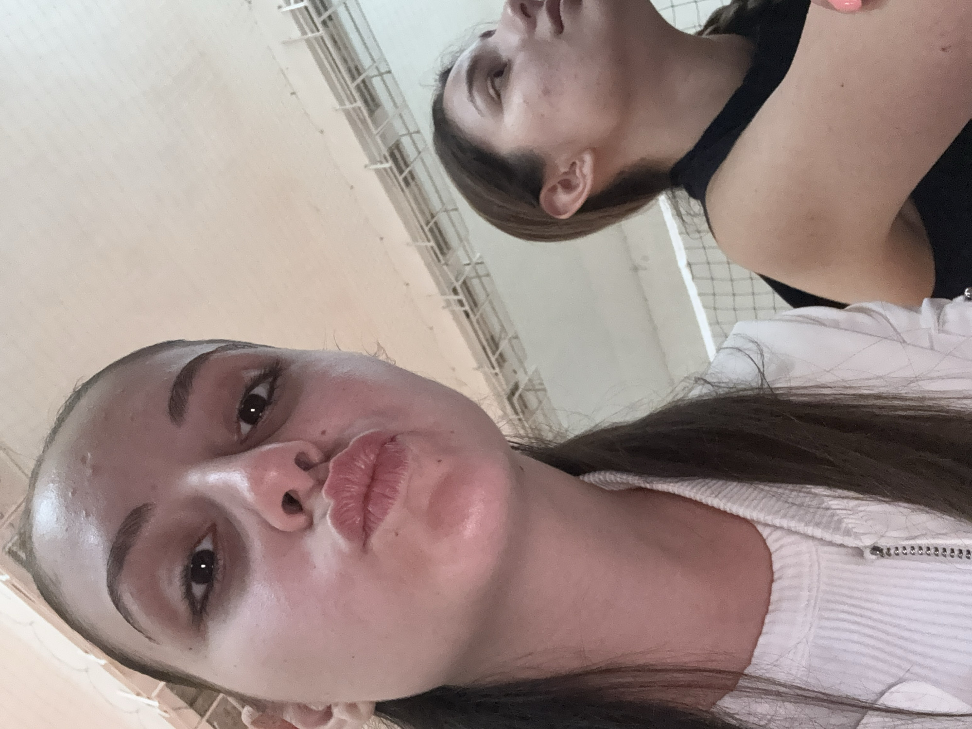 Young women photograph casual gathering in Bulgarian sports hall