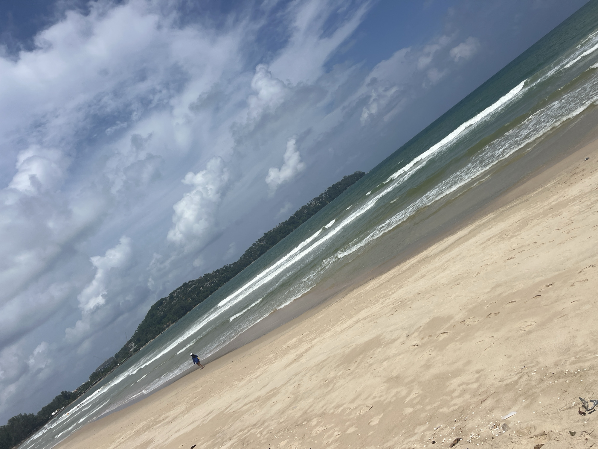 Surfers and beachgoers at Bang Tao Beach, Choeng Thale