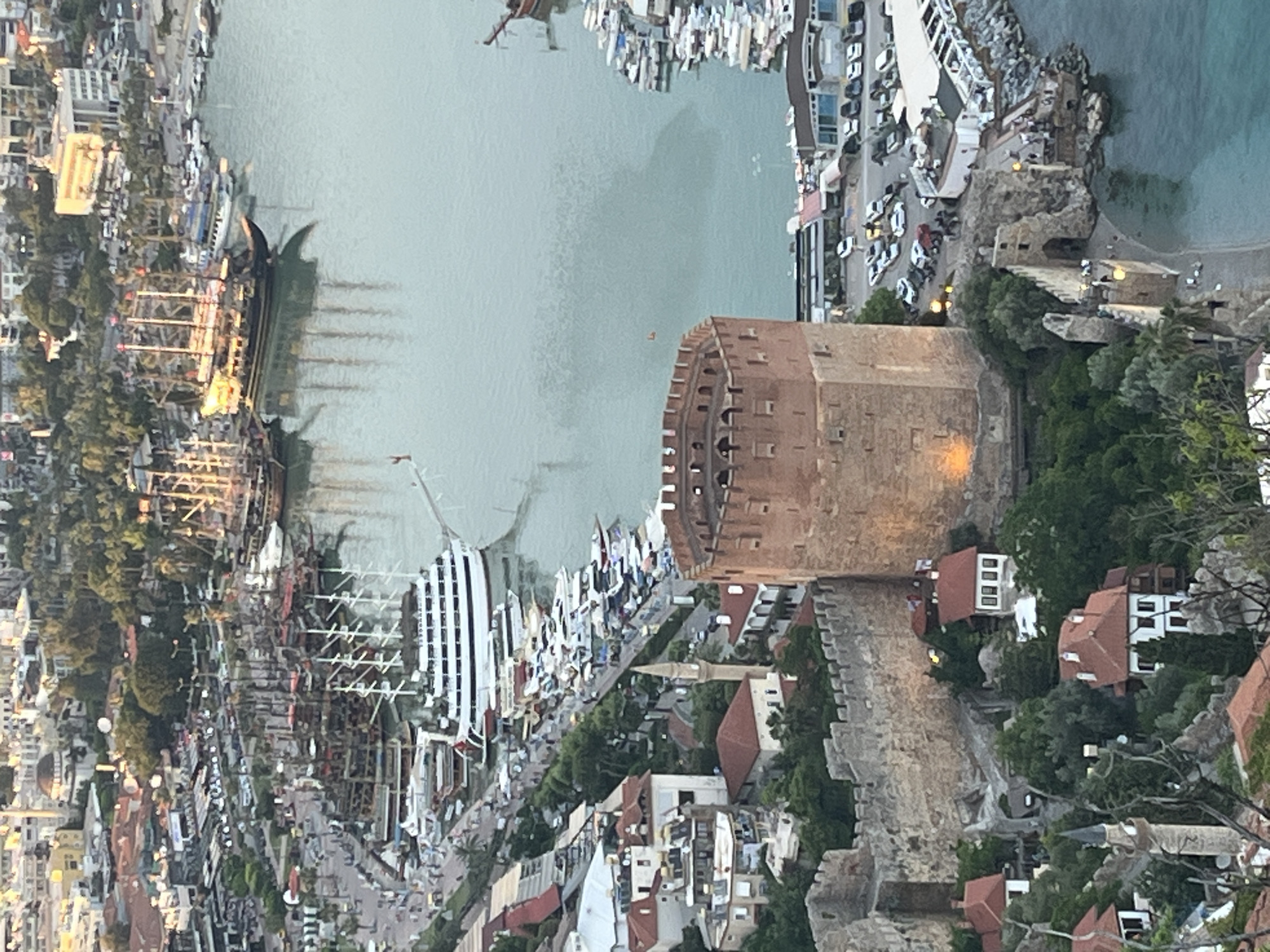 Tourists document scenic views of Turkey's historic Alanya coastline
