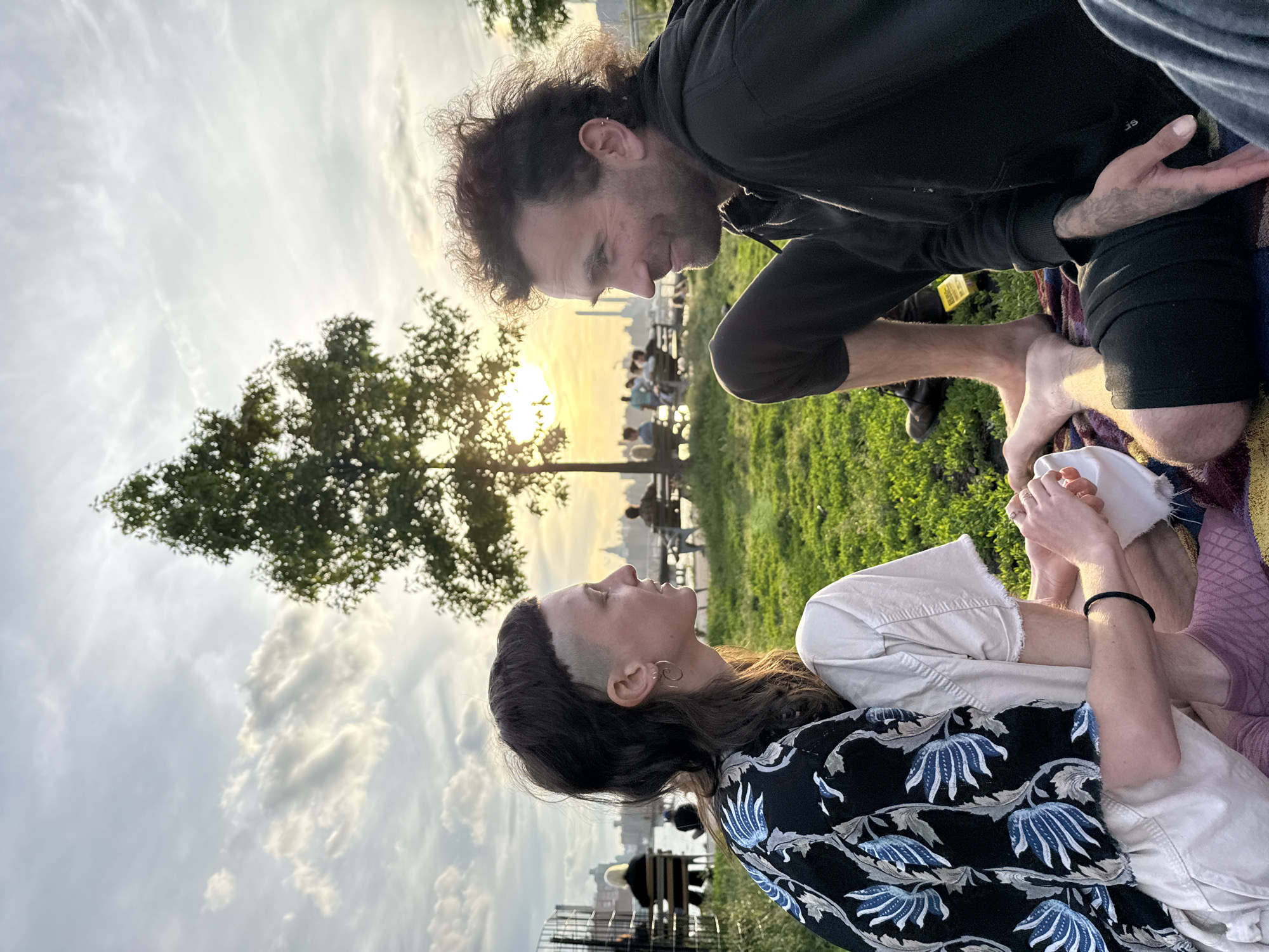 Couple shares intimate moment on park blanket in NYC