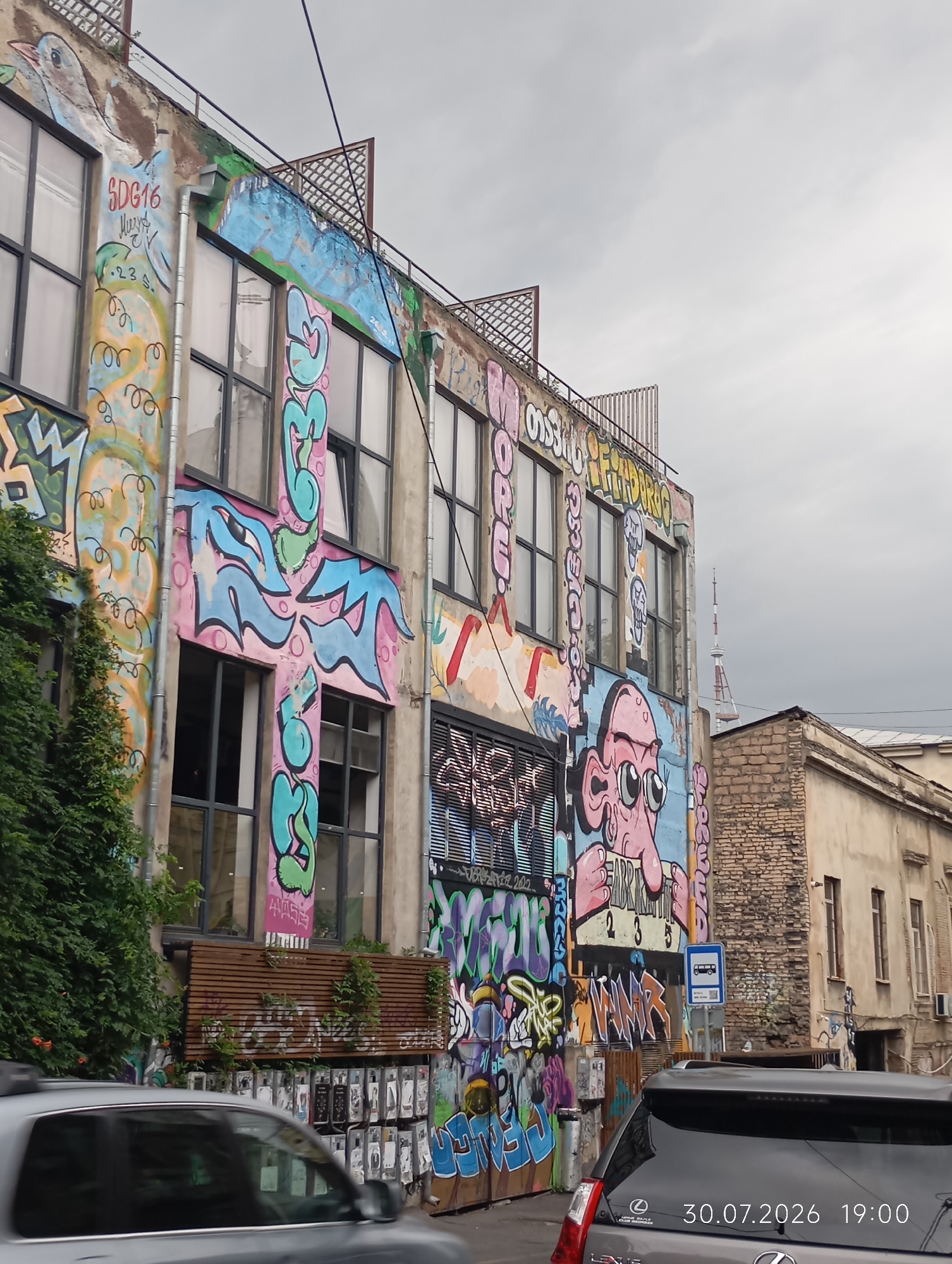 Graffiti walls, weathered streets, and themed cafés in Tbilisi