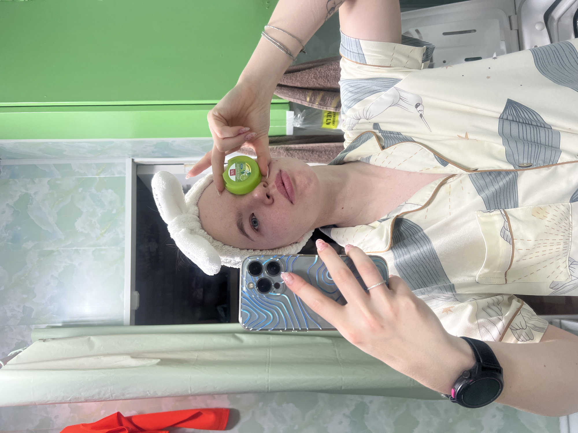 Woman documents nighttime routine in bathroom selfies in Chaikovsky