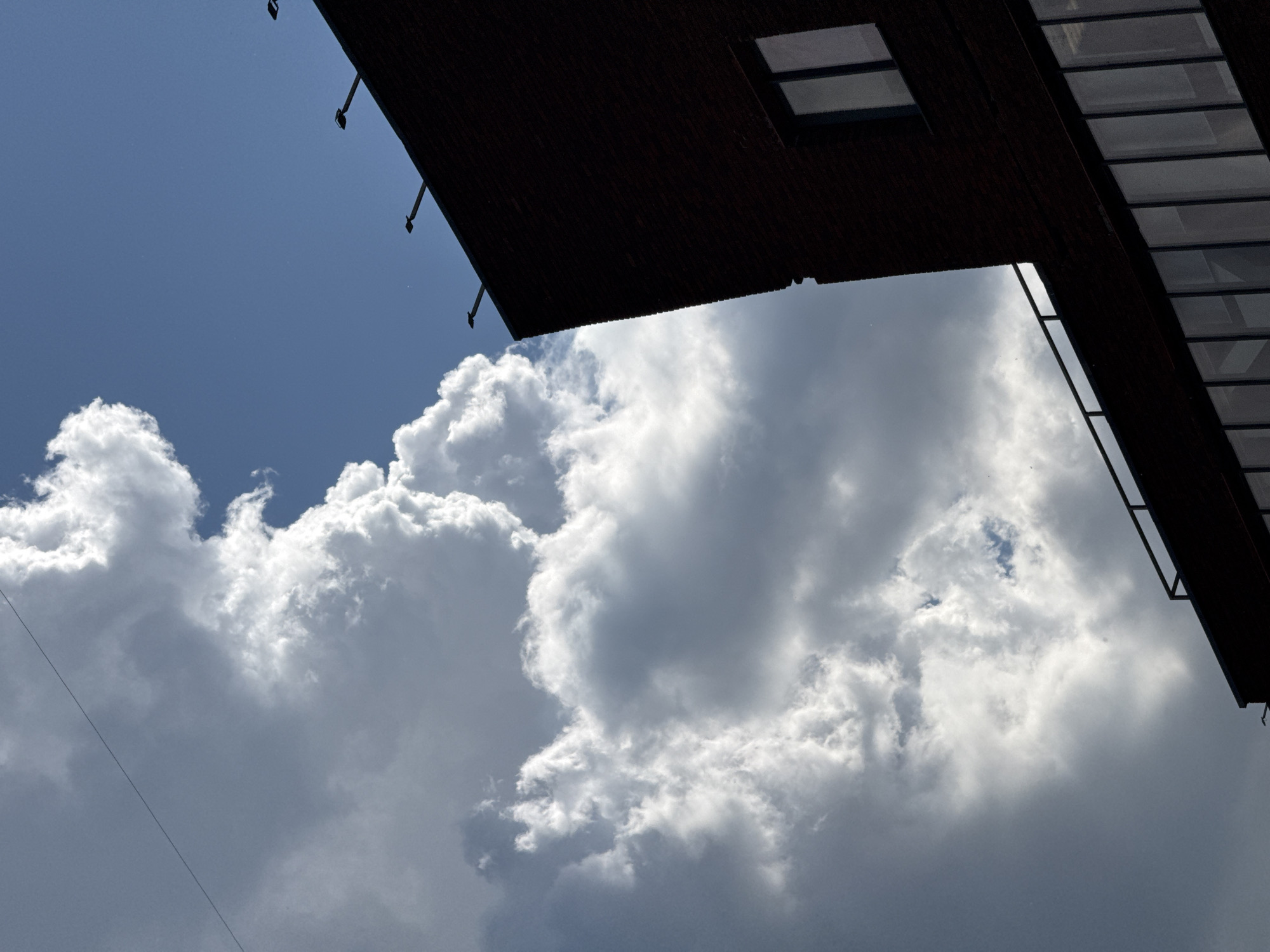 Dramatic clouds frame Moscow construction site and buildings