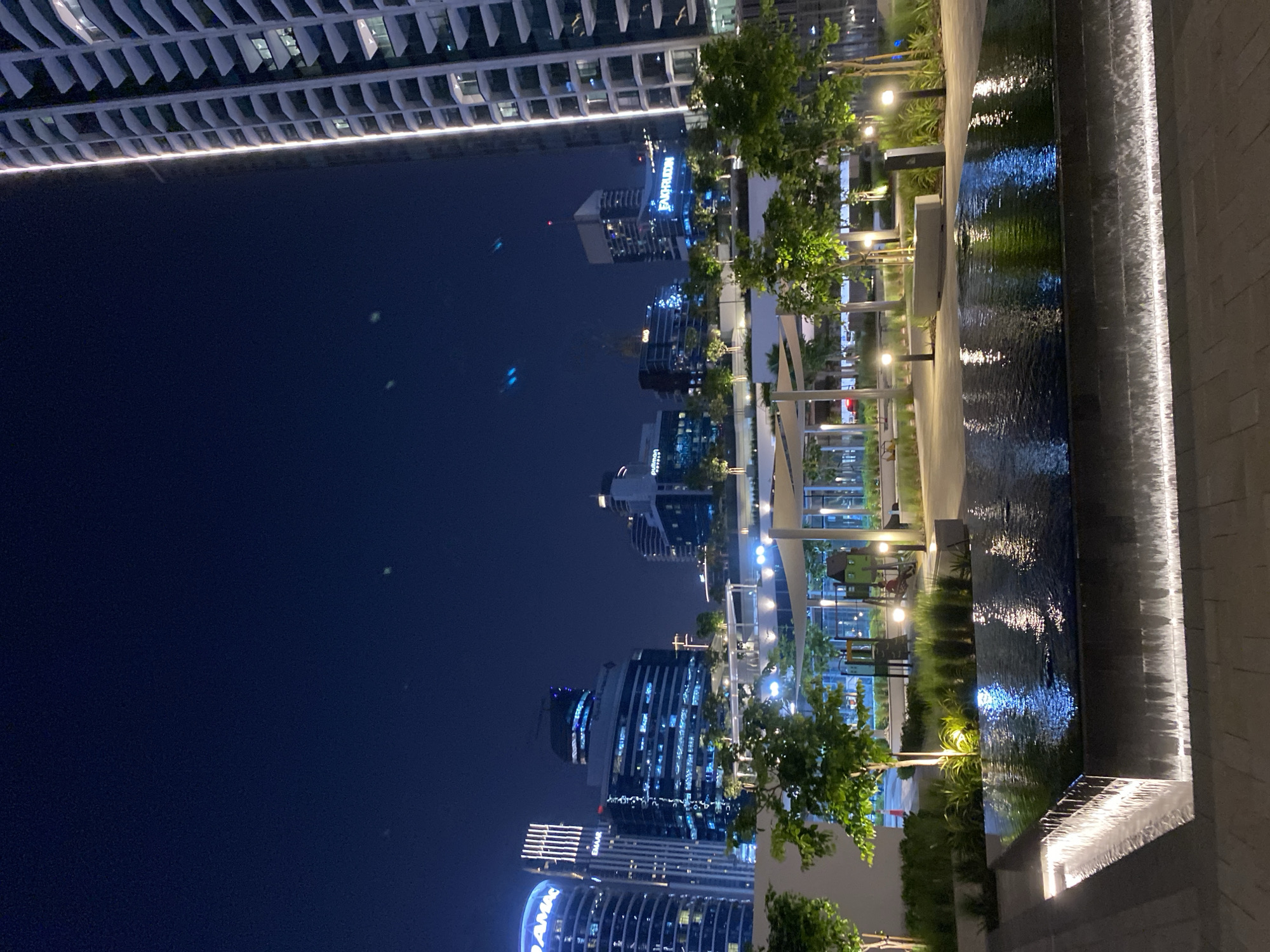 Nighttime urban scene observed in Dubai featuring illuminated buildings