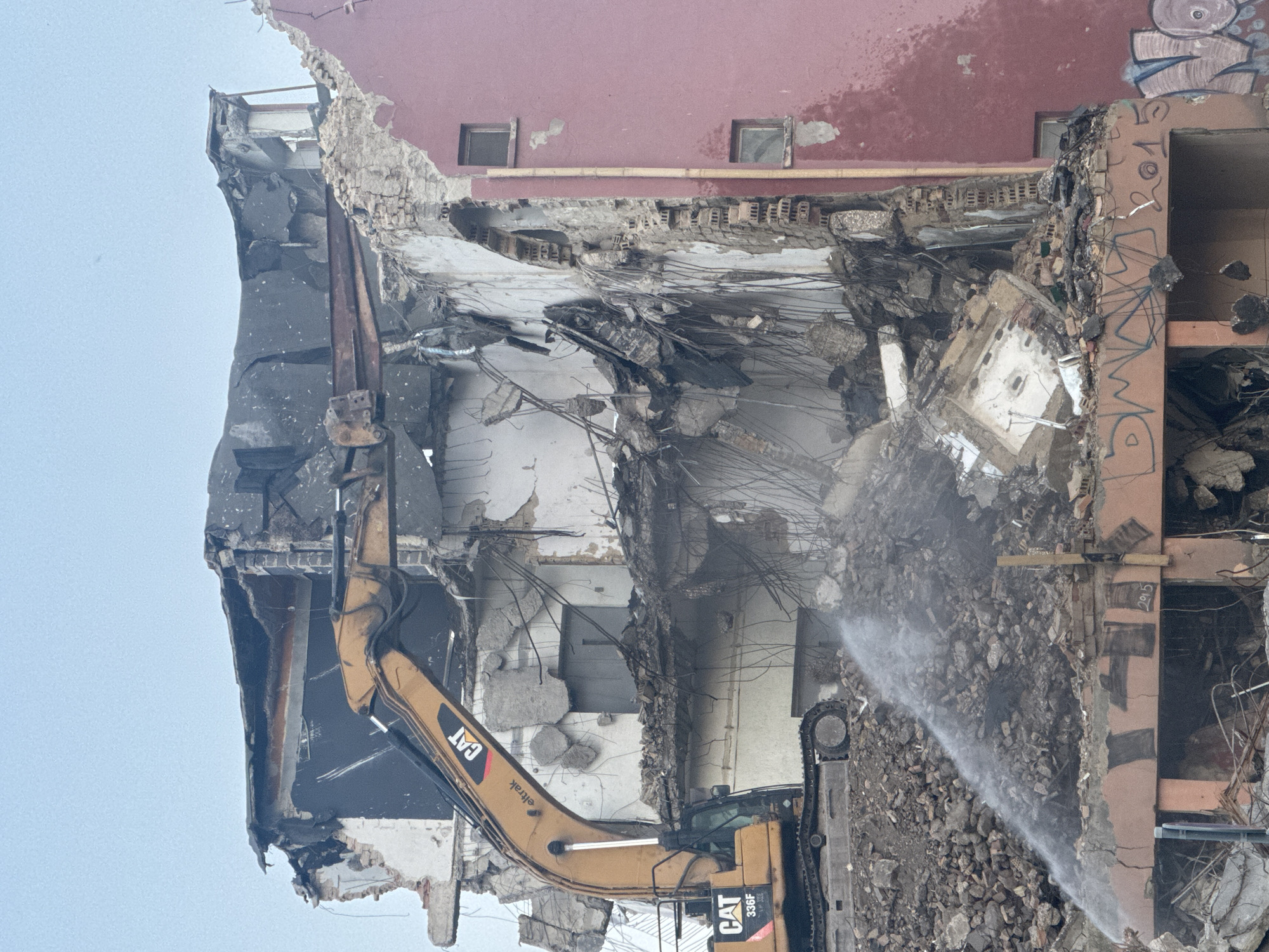 CAT excavator demolishes collapsed building in Varna