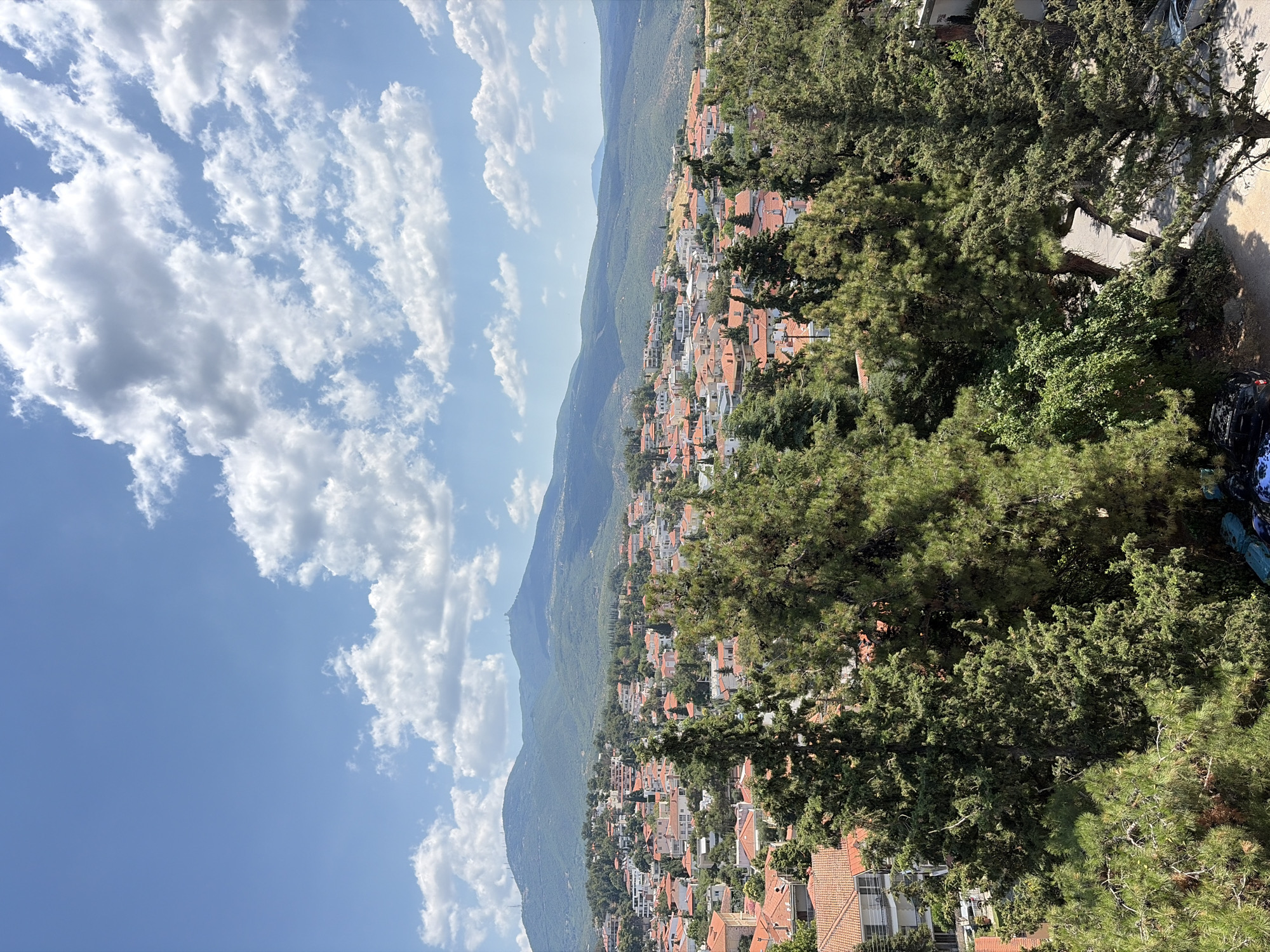 Hillside town views and a marble bathroom in Panorama, Greece