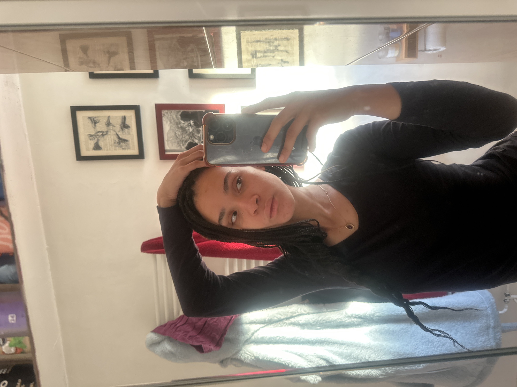 Woman takes mirror selfie in early morning Ealing
