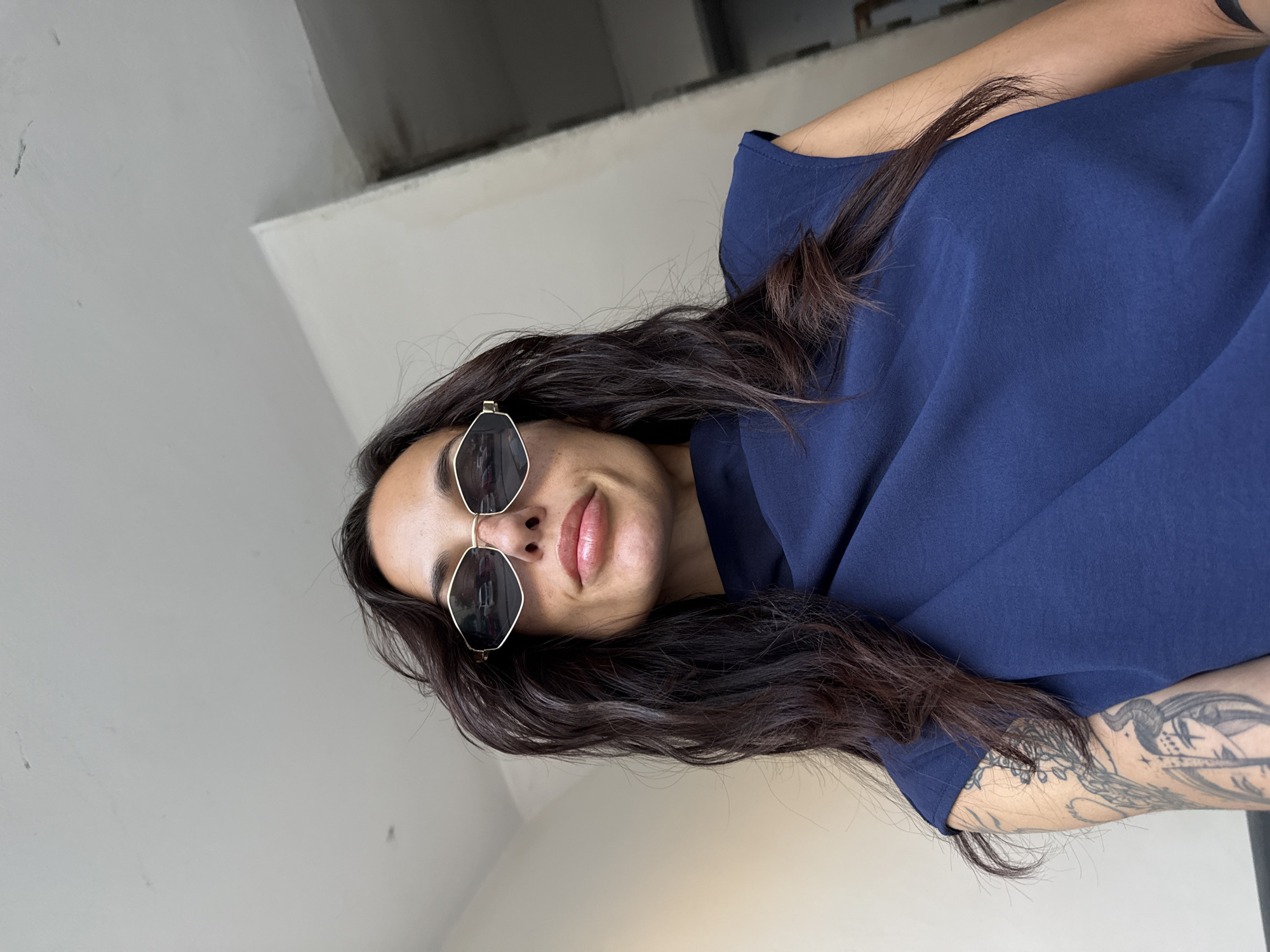Woman in sunglasses spotted indoors in Pleven building hallway