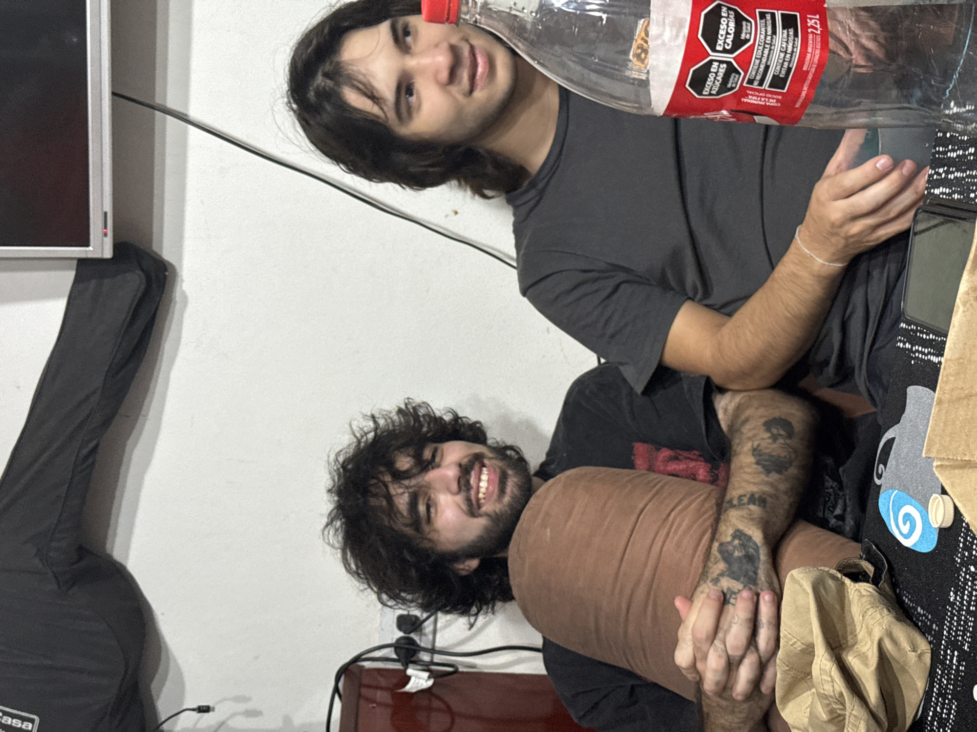 Young men share drinks at casual gathering in Catamarca