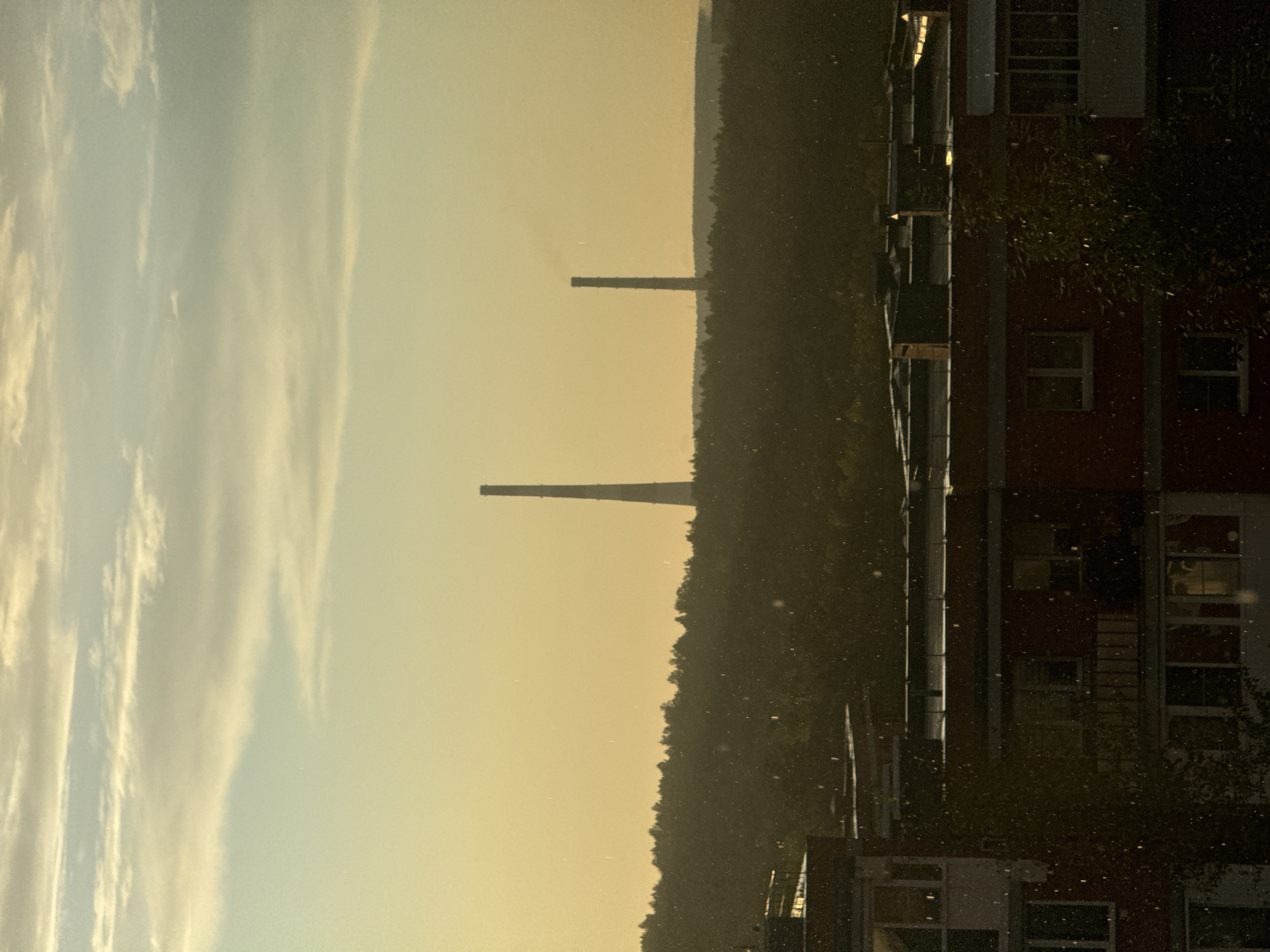 Sunset burns orange over Markova's apartment blocks and chimneys