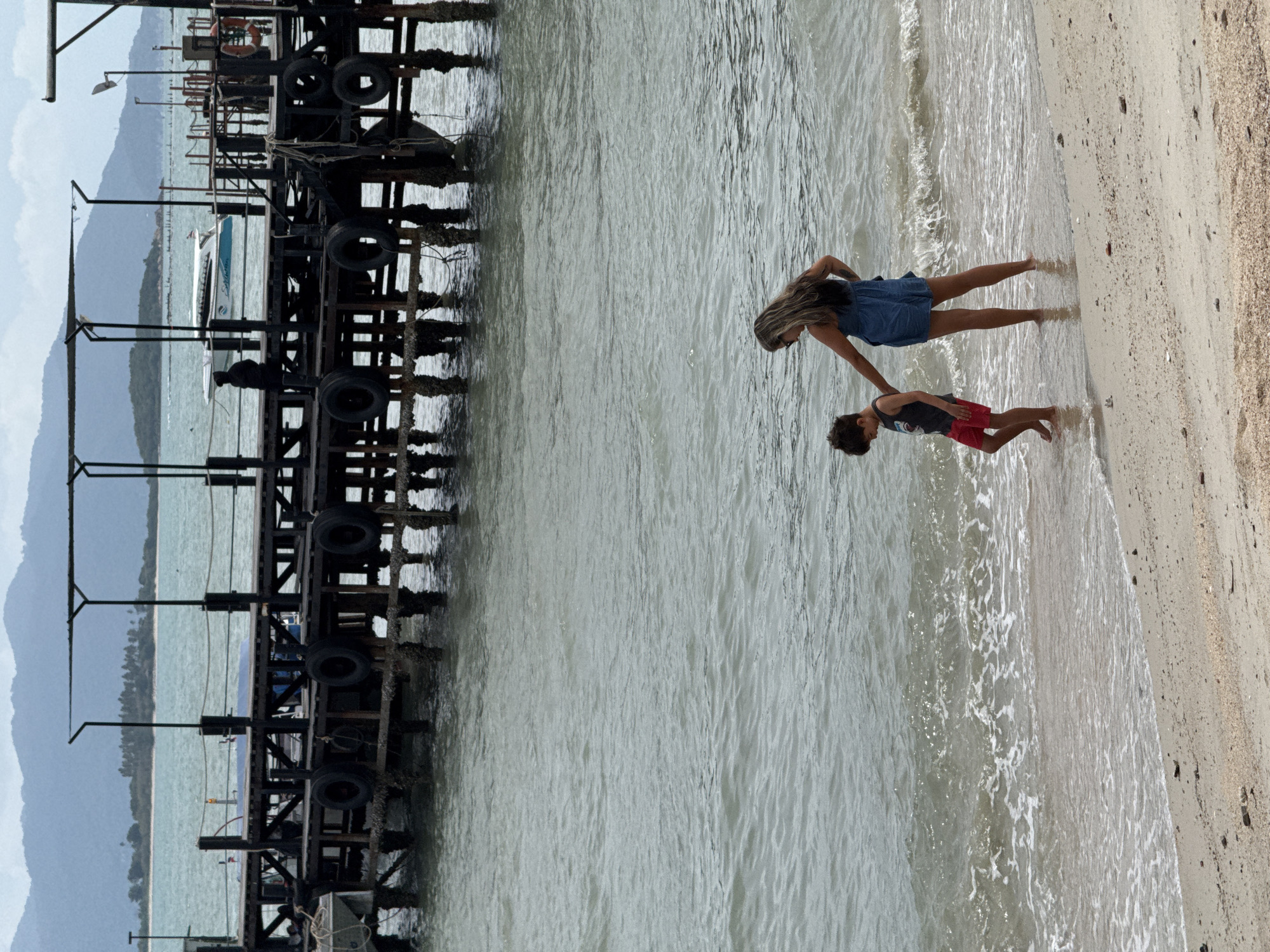 Beachside morning in Ko Samui: shoreline, pier, and cafe coffee