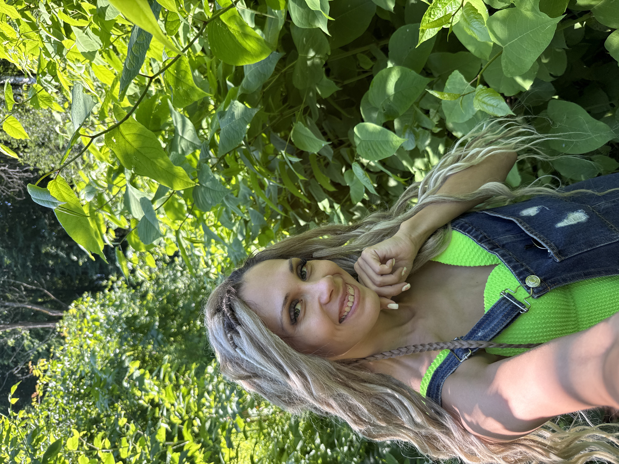 Woman takes forest selfies in early morning near Rusanovo