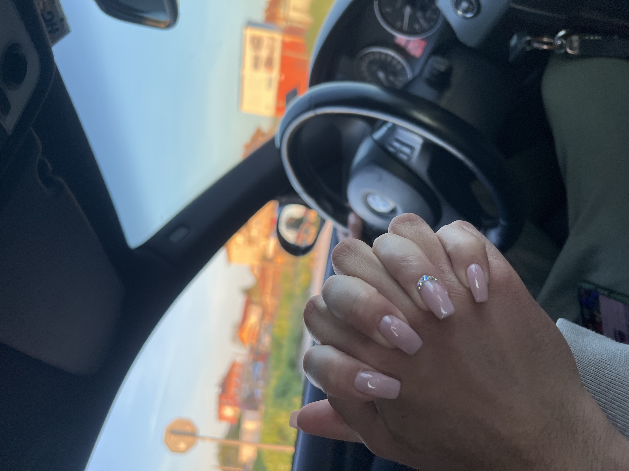 Intimate moment captured between two people in BMW, Plovdiv