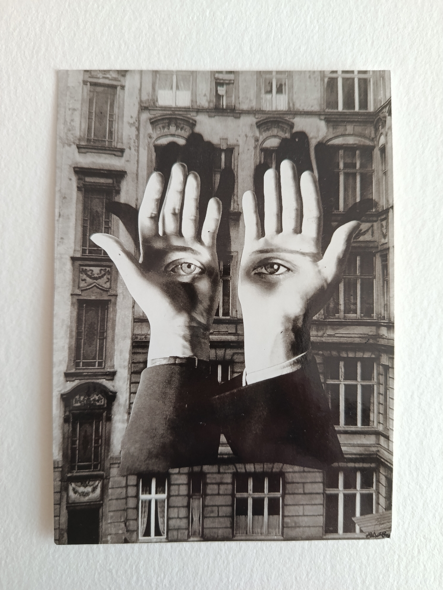 Surreal black-and-white print displayed on Moscow wall