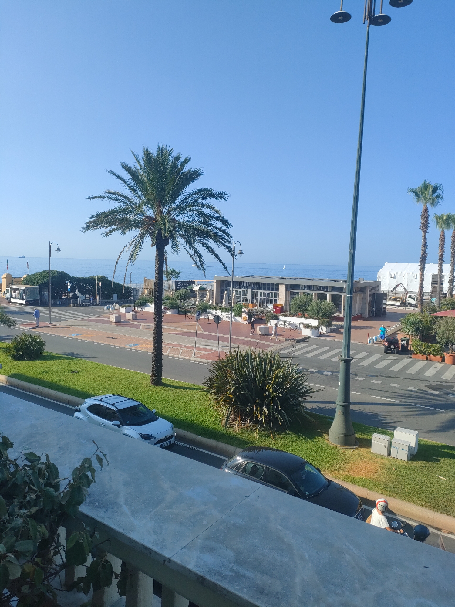 Genoa's sunny coastal strip, palm trees and seaside venues