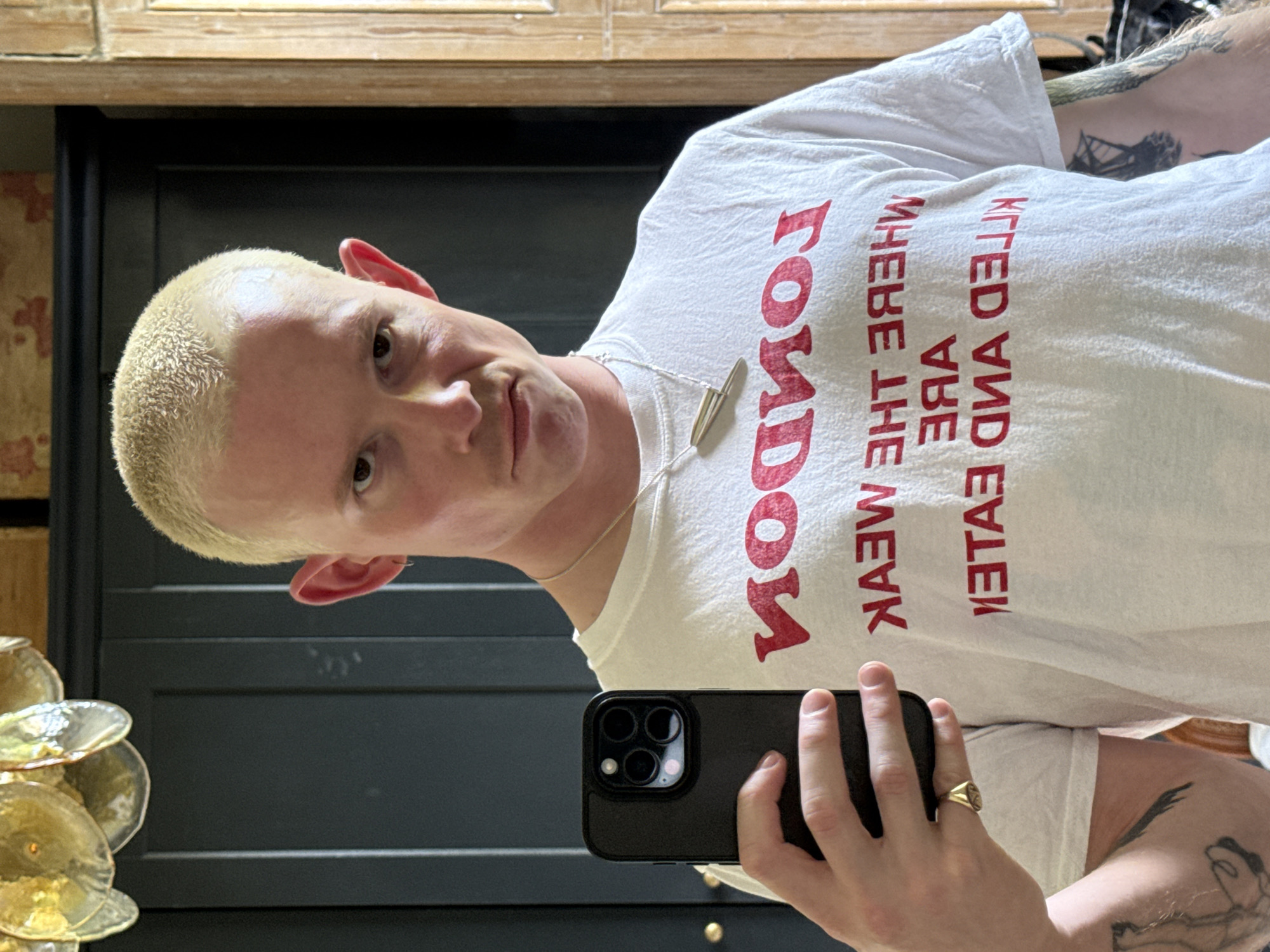 Person Takes Mirror Selfie in London Wearing Provocative T-Shirt
