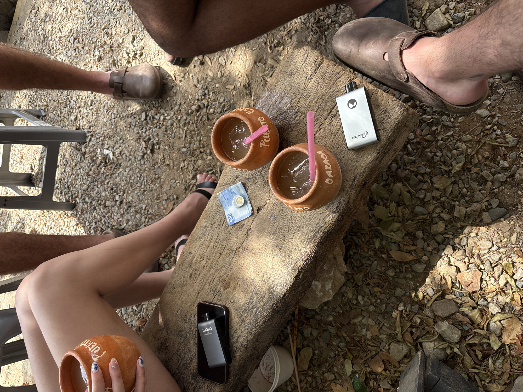 Four people share outdoor meal in Brisas de Zicatela