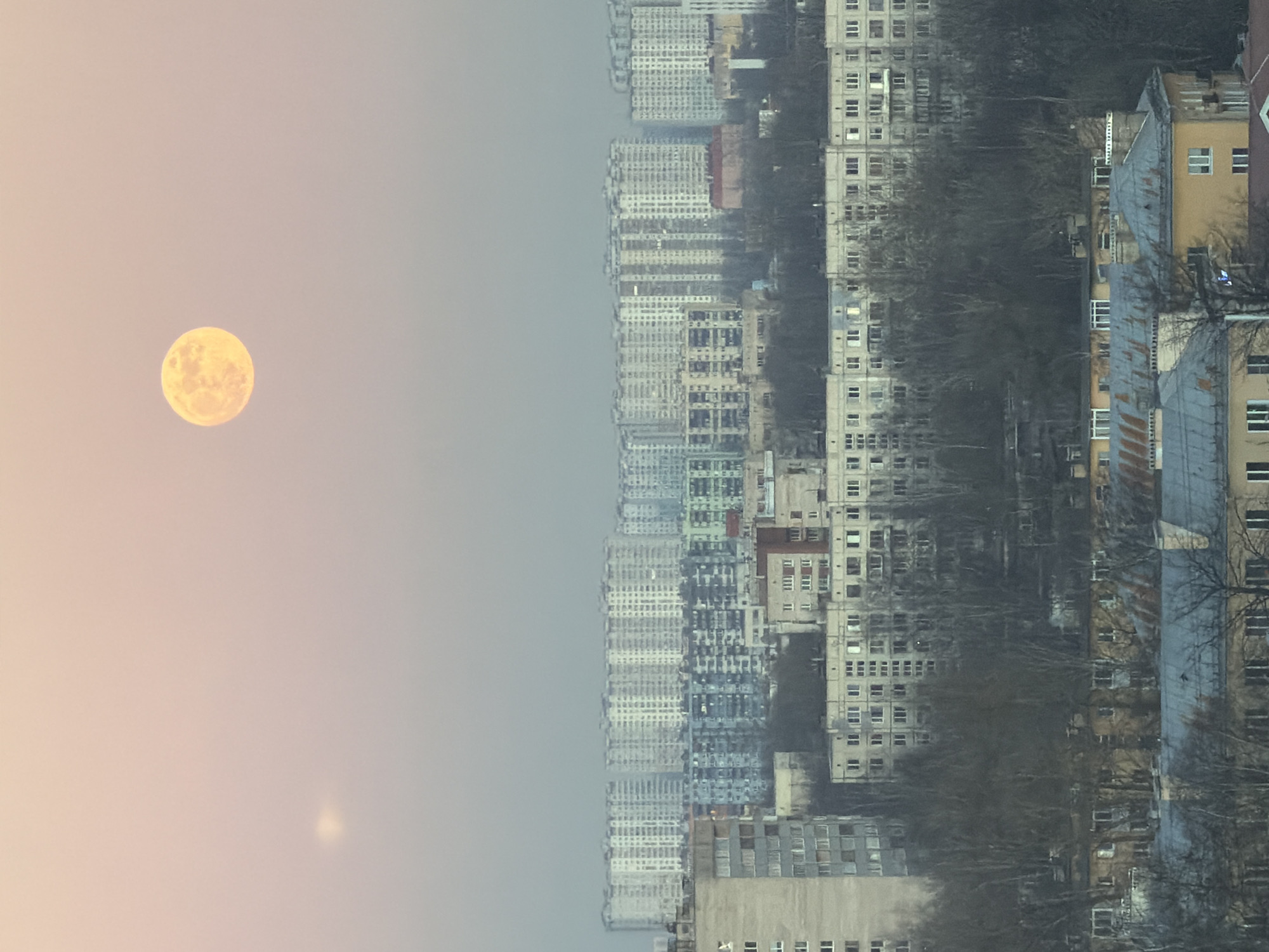 Full moon rises over Vsevolozhsk apartment towers