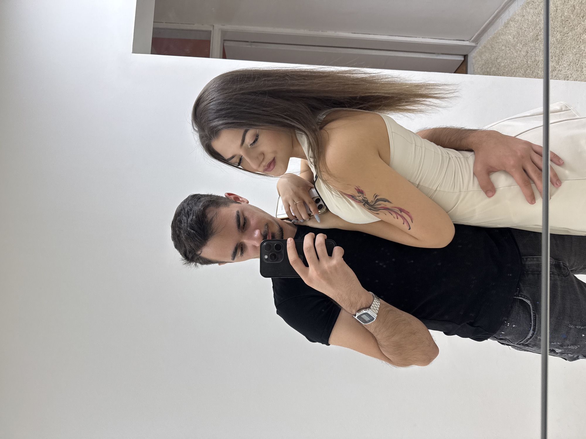 Couple Takes Mirror Selfies in Sofia Hallway