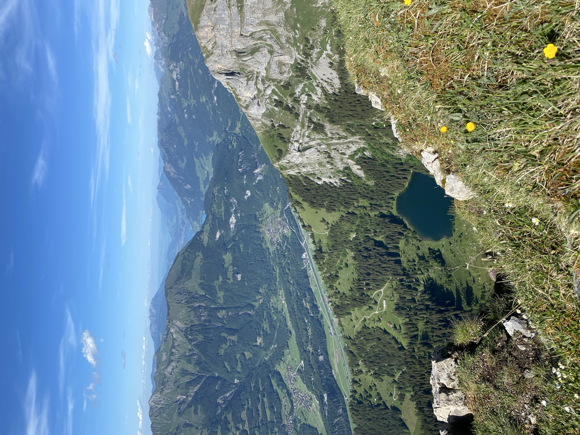 Mountain hiking break overlooking Lake Brienz in Swiss Alps