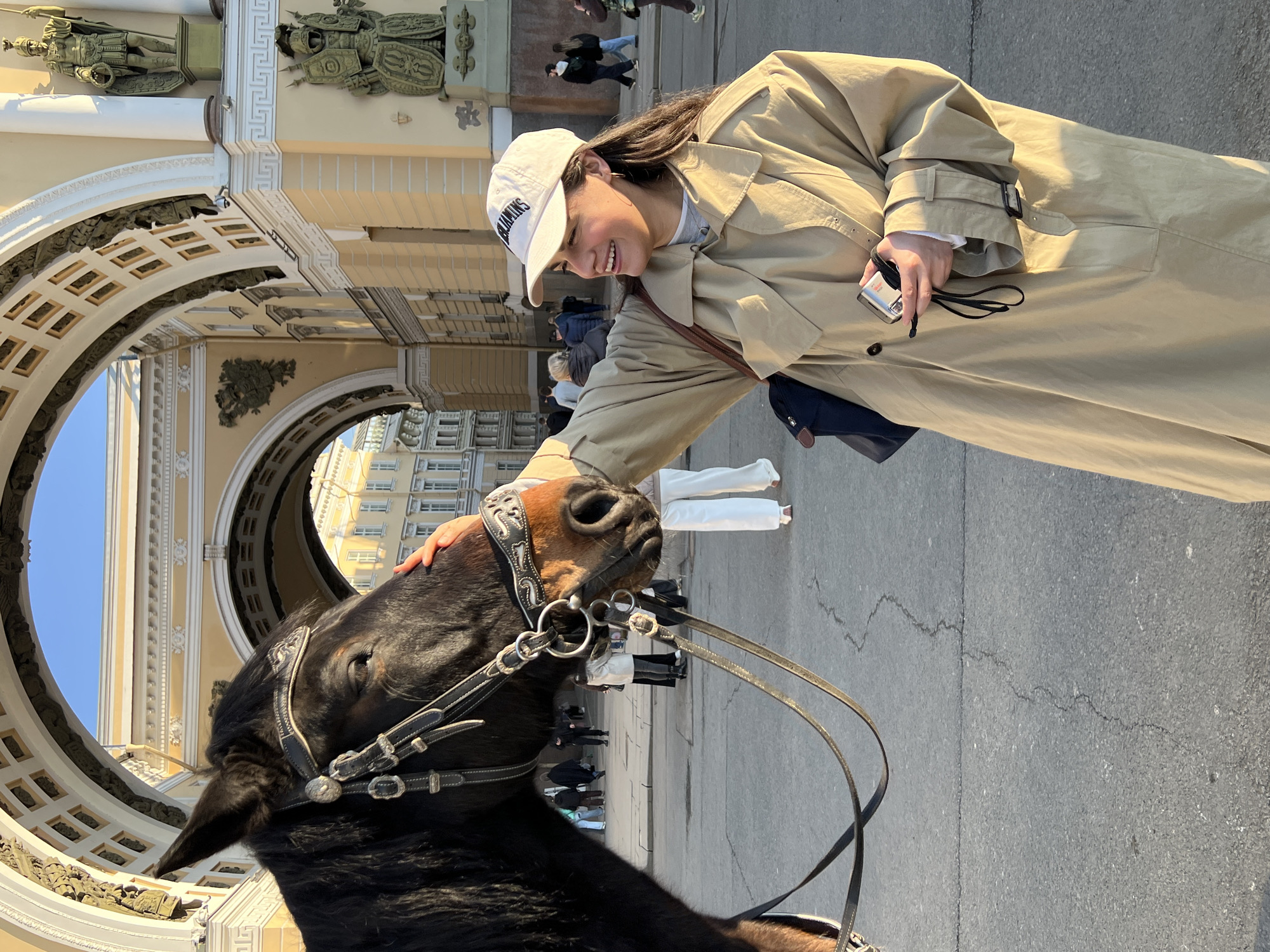 Woman pets horse on Saint Petersburg street