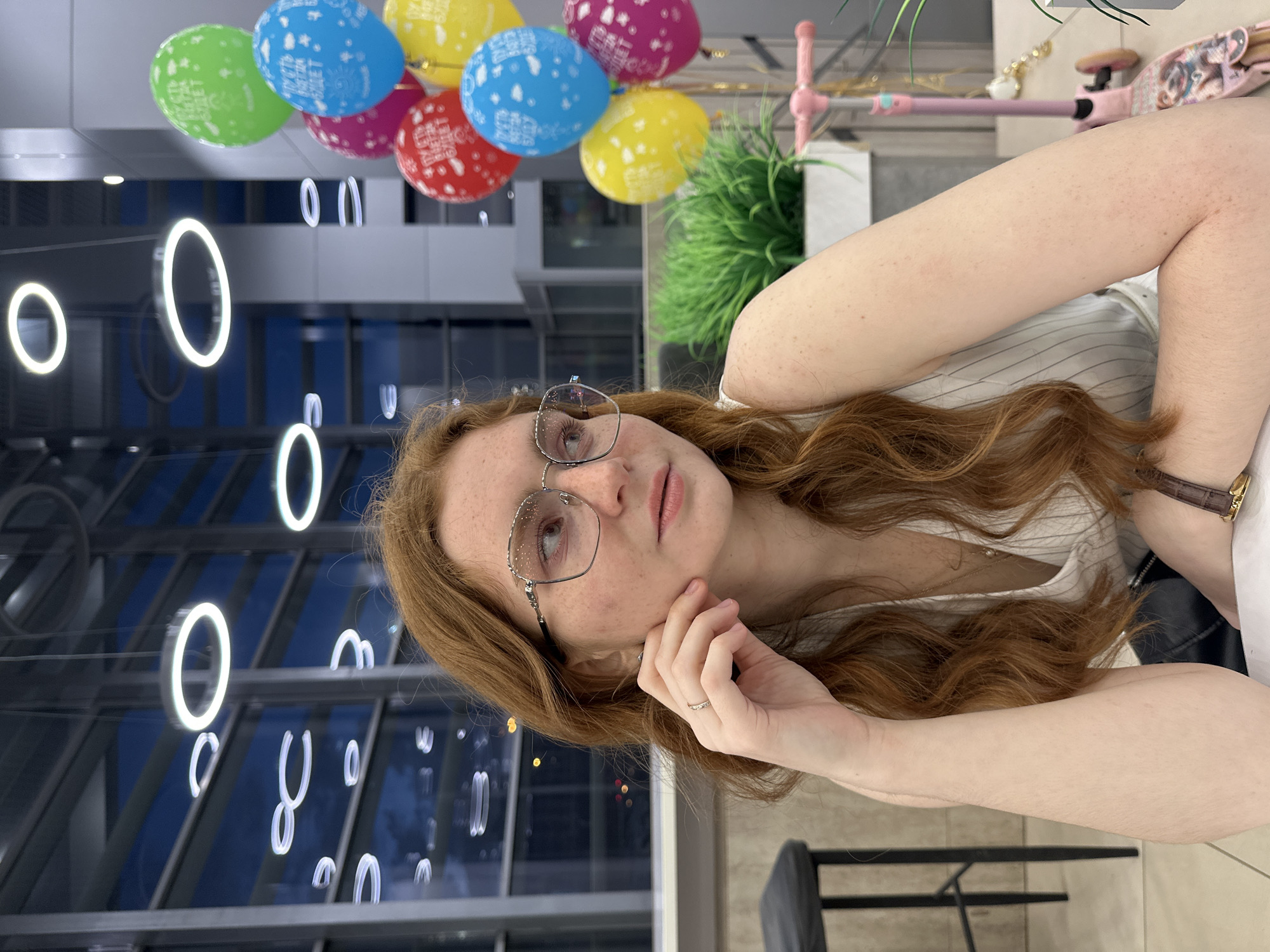 Young woman photographed repeatedly across Kazan indoor locations