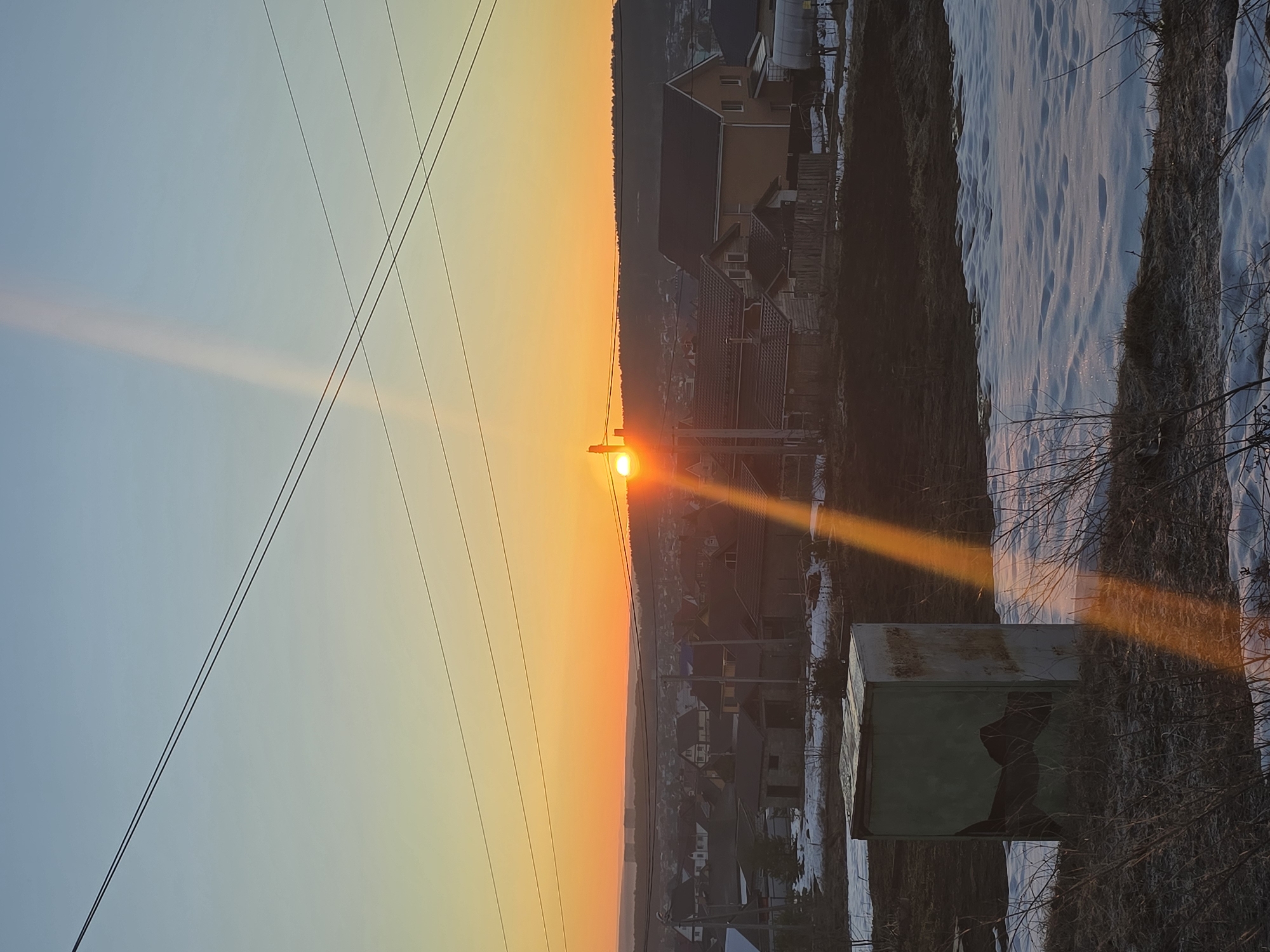 Sunrise observed over Chaikovsky, Russia rural and residential areas