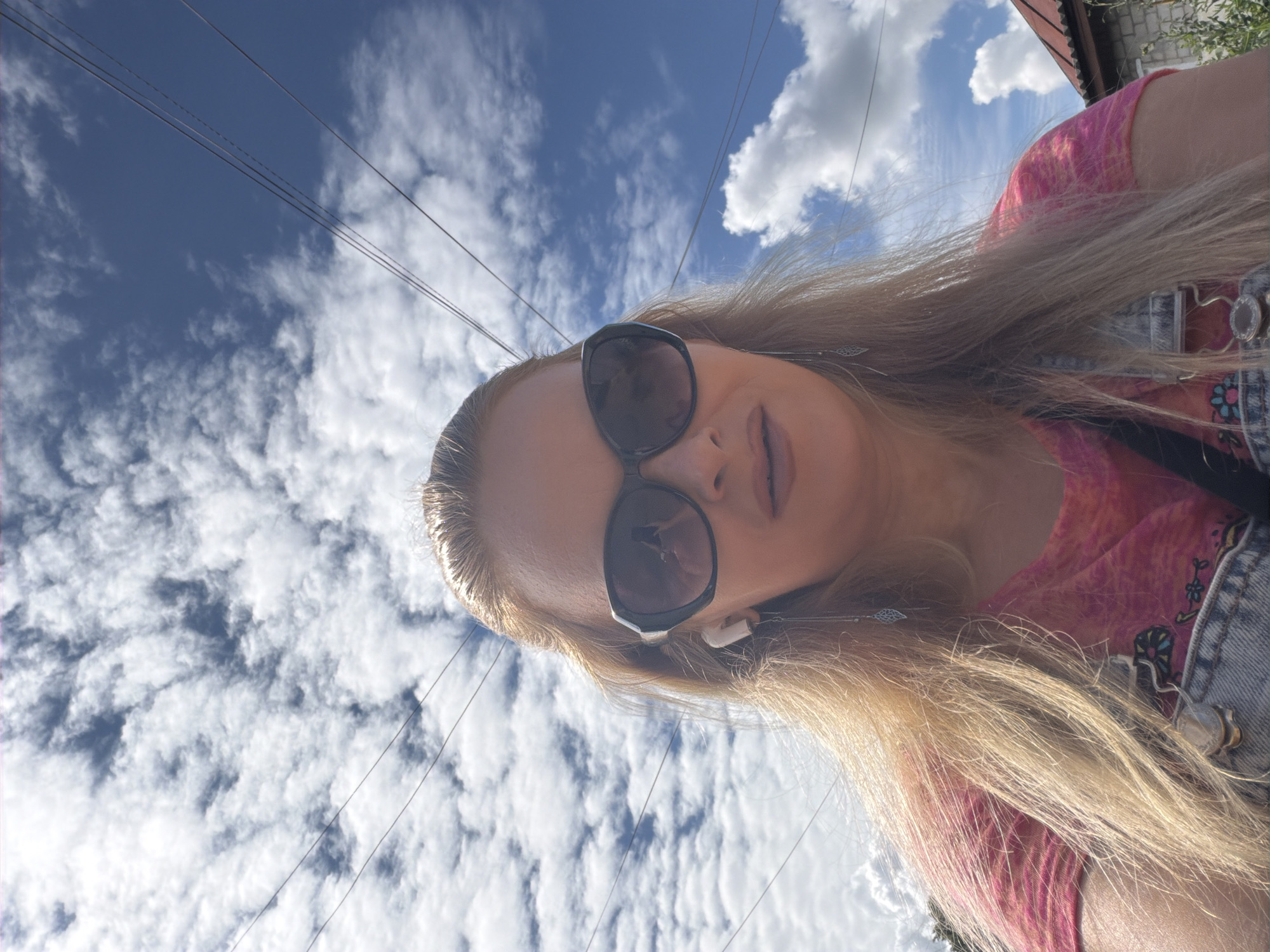 Outdoor selfie session with close-ups of nearby plants and sky