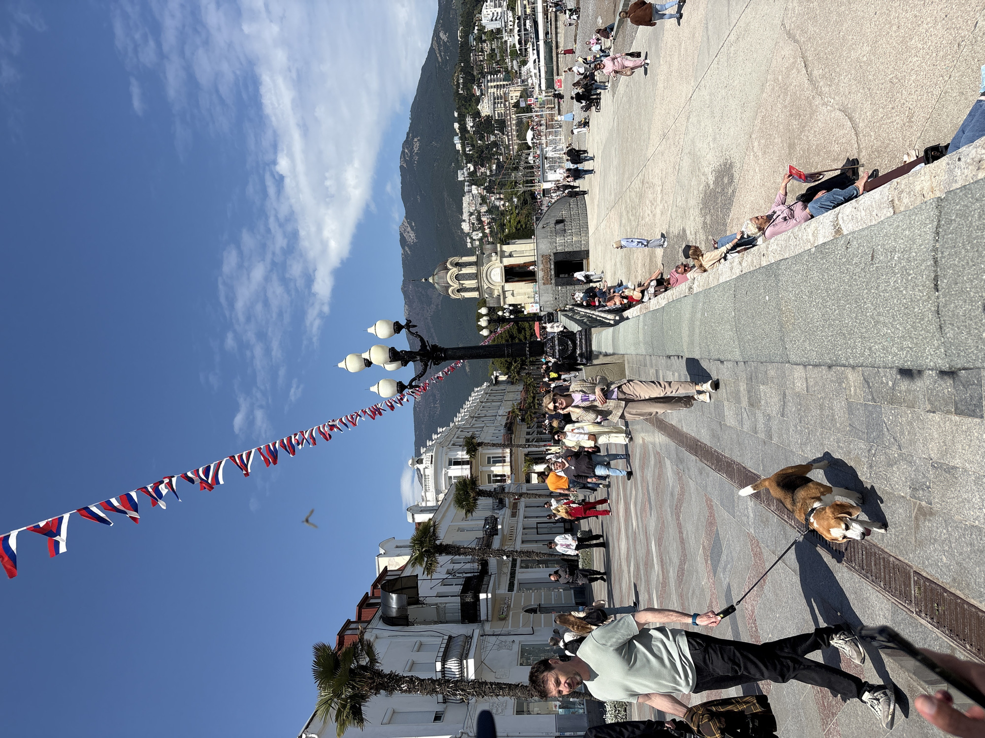 Everyday scenes unfold along Yalta waterfront on sunny spring morning