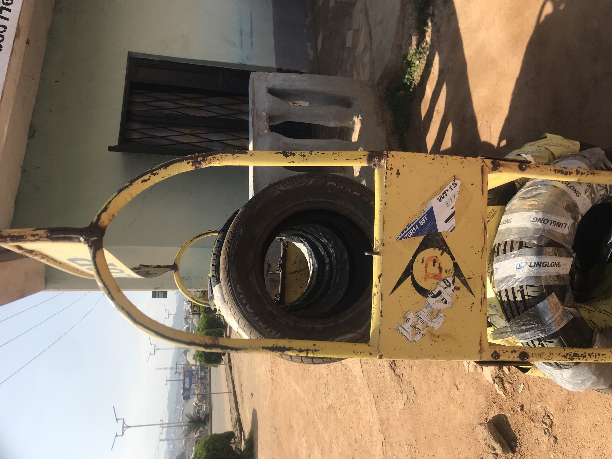Street scenes captured in Jos Nigeria auto-rickshaws tire stand