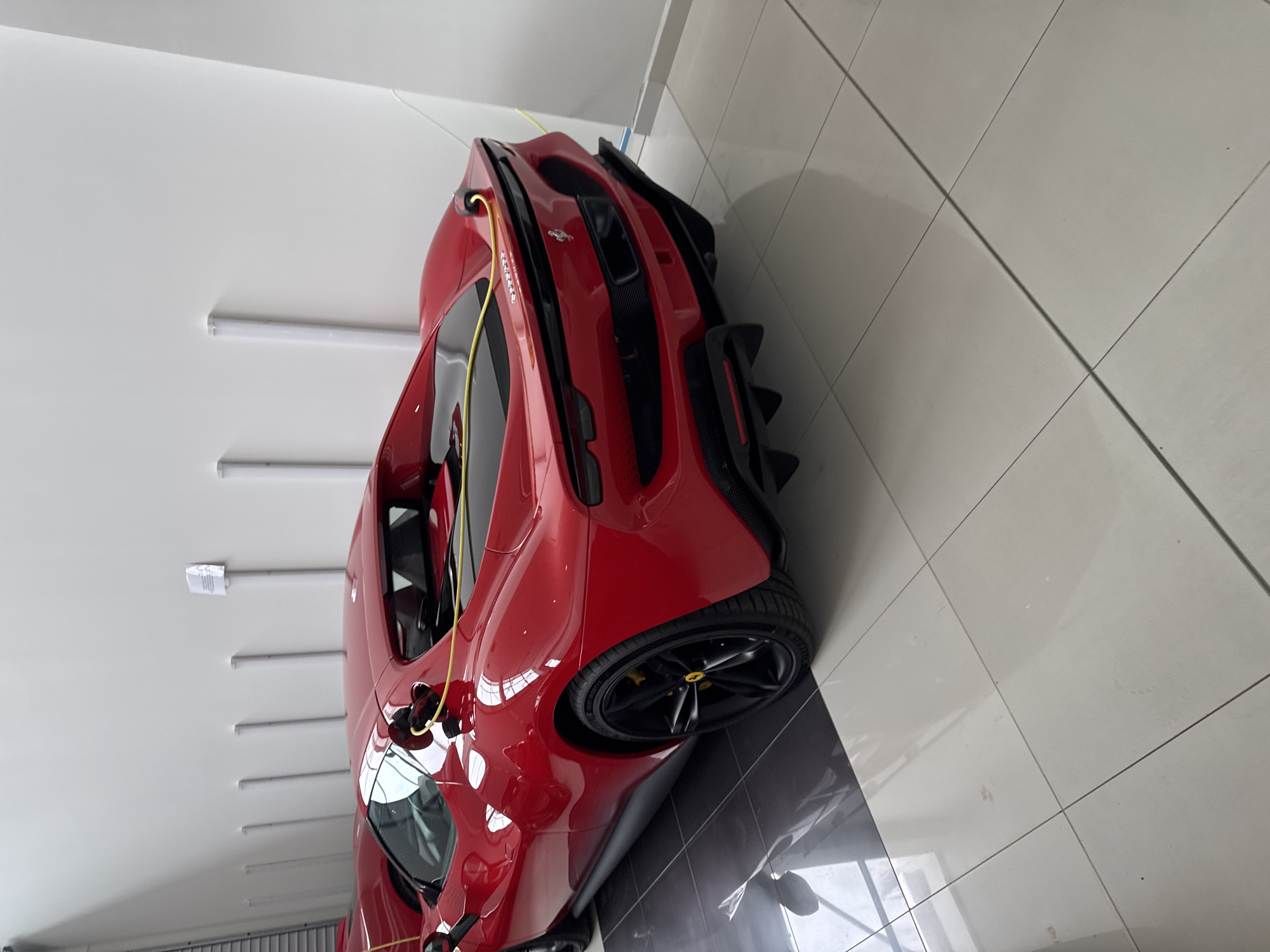 Red Ferrari SF90 Stradale spotted indoors in Sofia