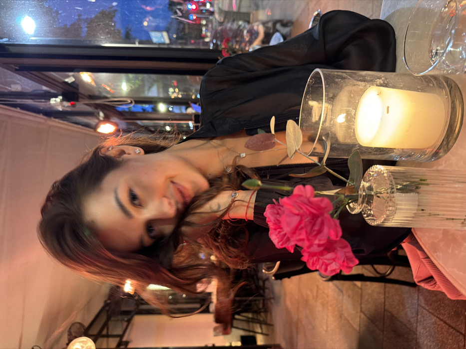 Woman dines at Tel-Aviv restaurant during evening hours