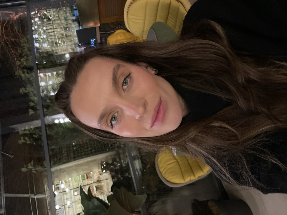Woman takes evening selfie session across Budva locations