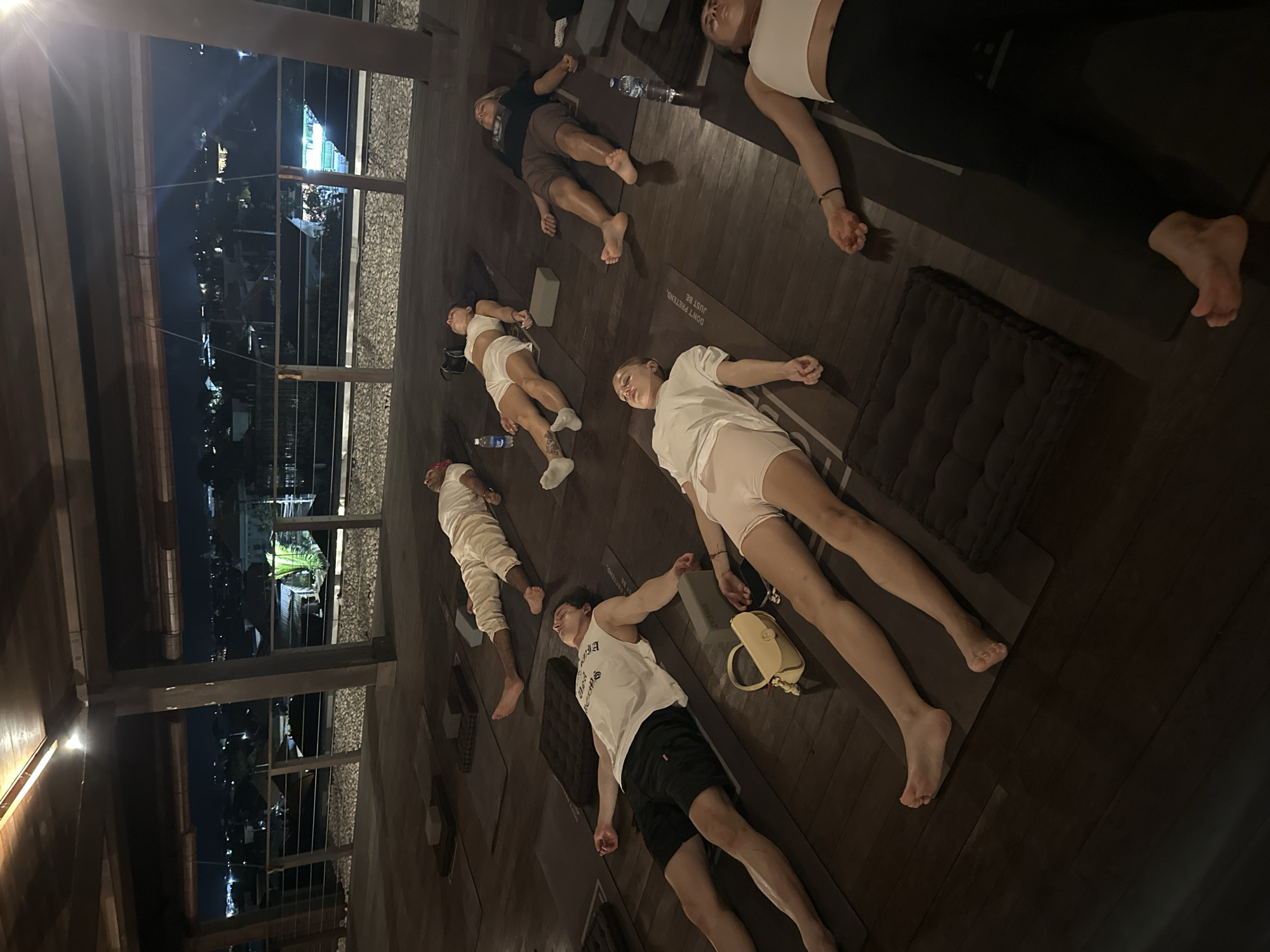 Yoga session observed in Mengwi indoor space overlooking cityscape