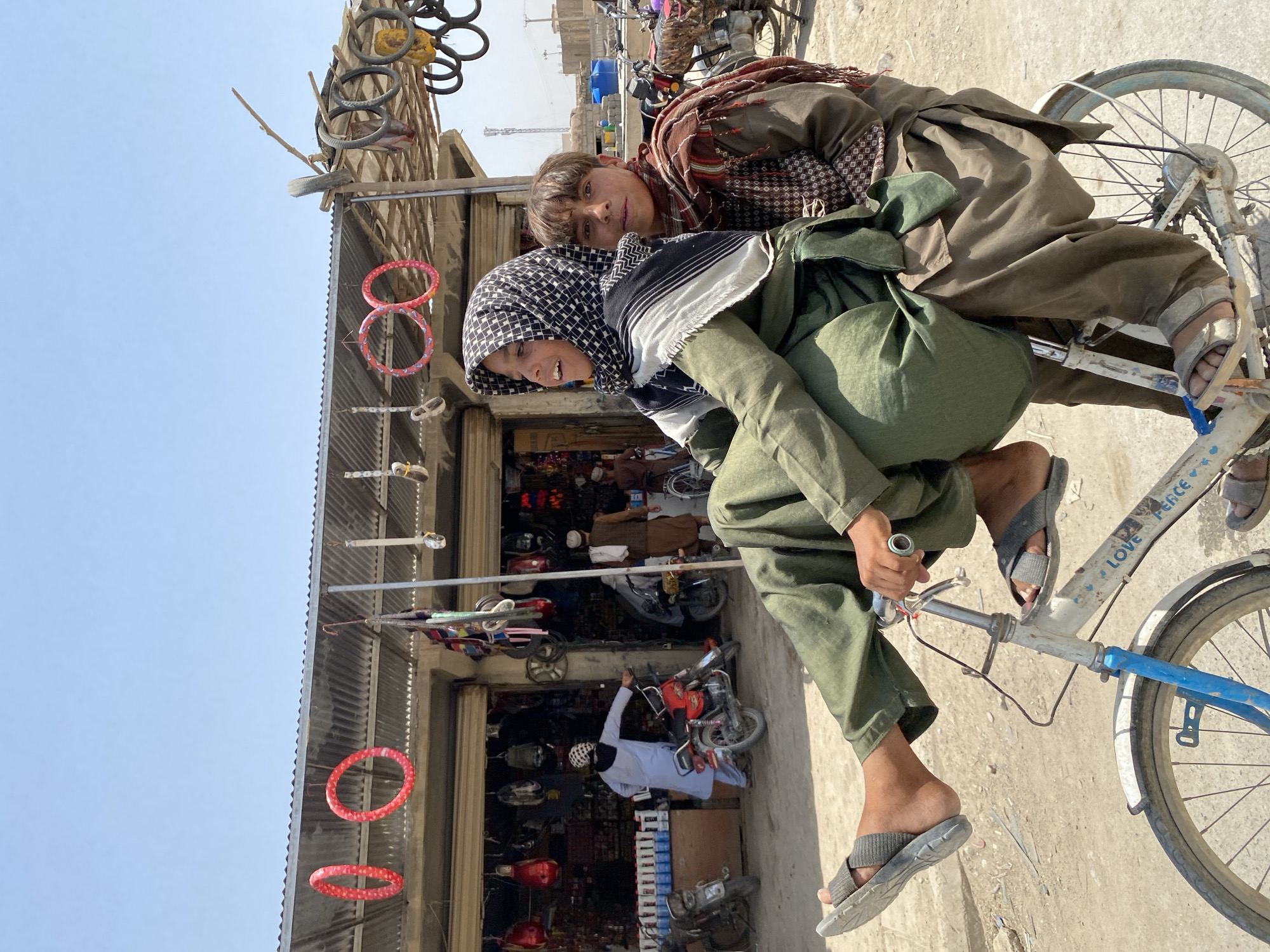 Sharing a bicycle through the streets of Kandahar