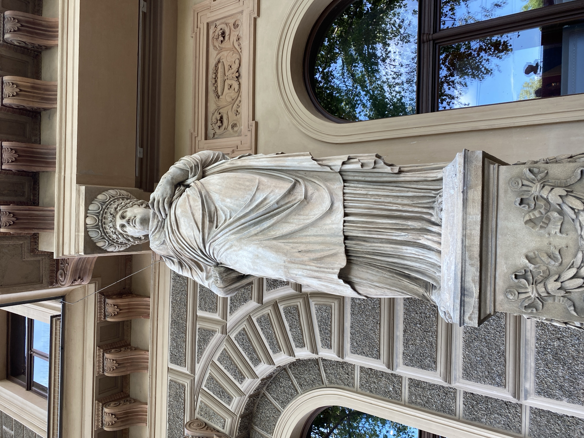 Visitor documents Vienna gardens, statue and Theseus Temple