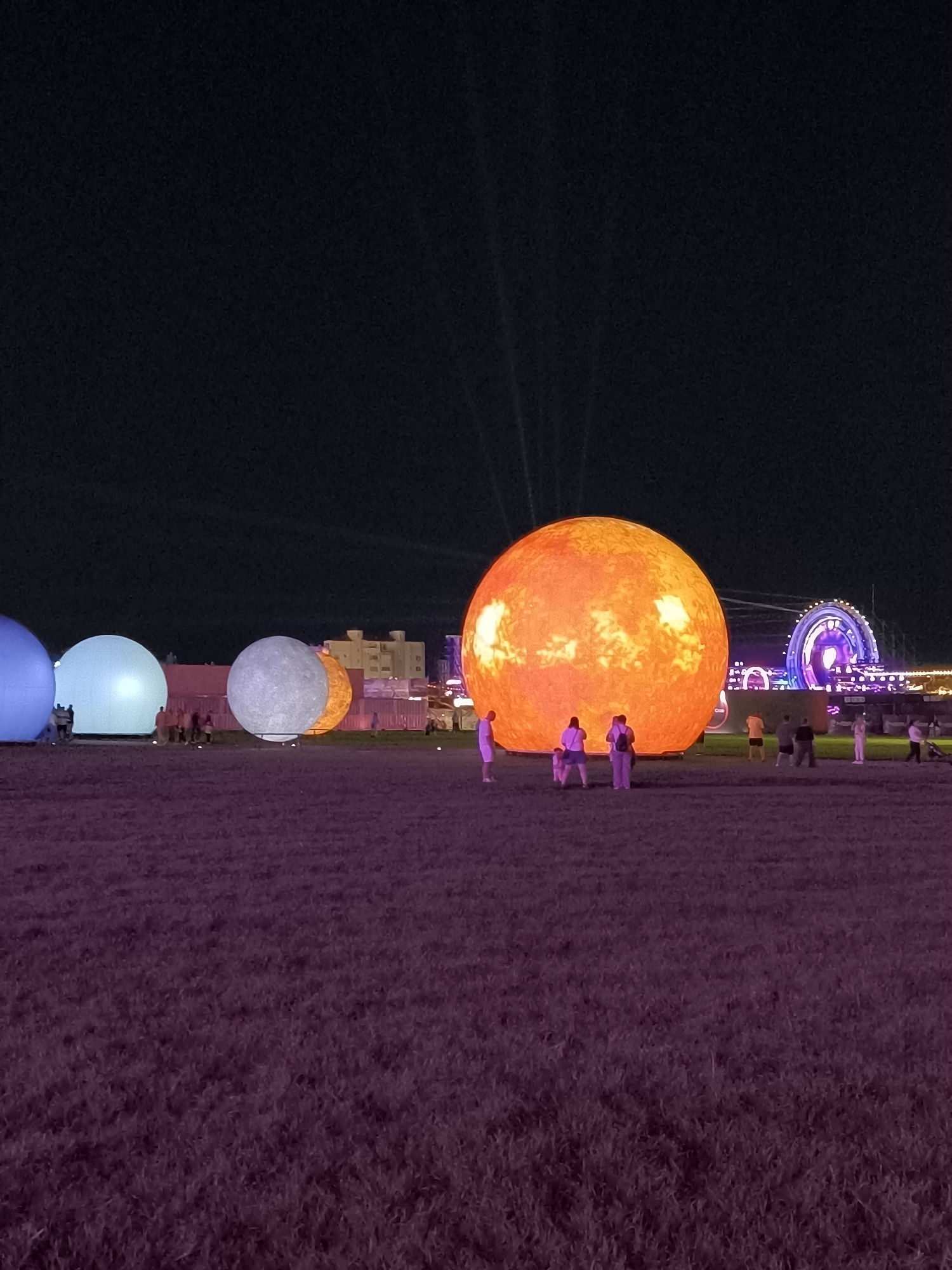 Inflatable planet installation lights up a field in Costinești