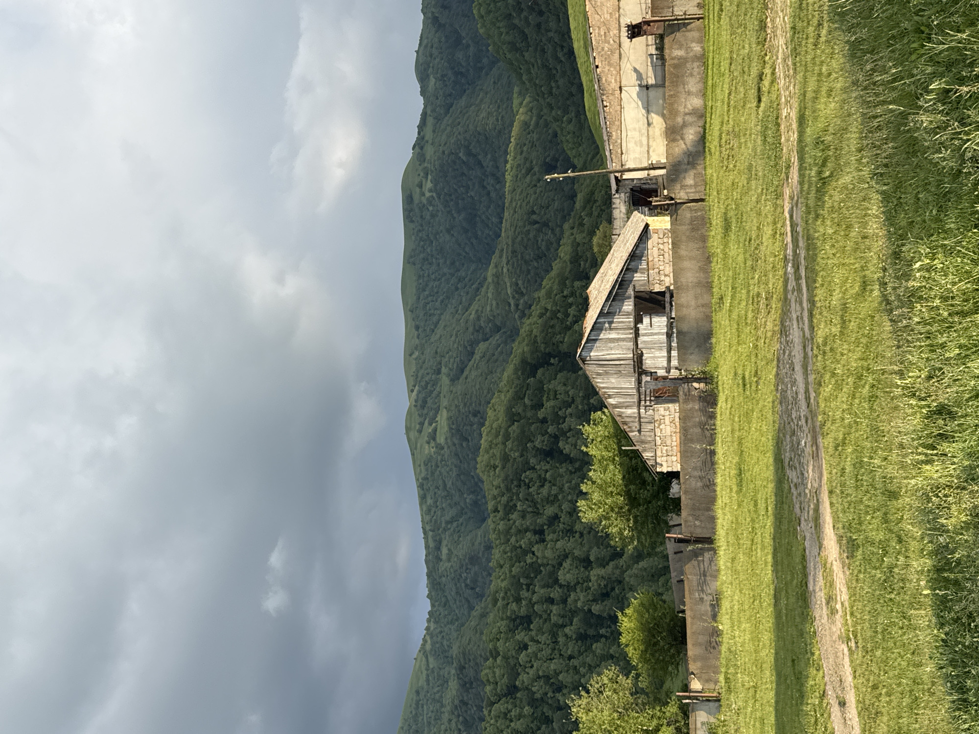 Nizhnyaya Mara village and mountain landscapes on a summer afternoon