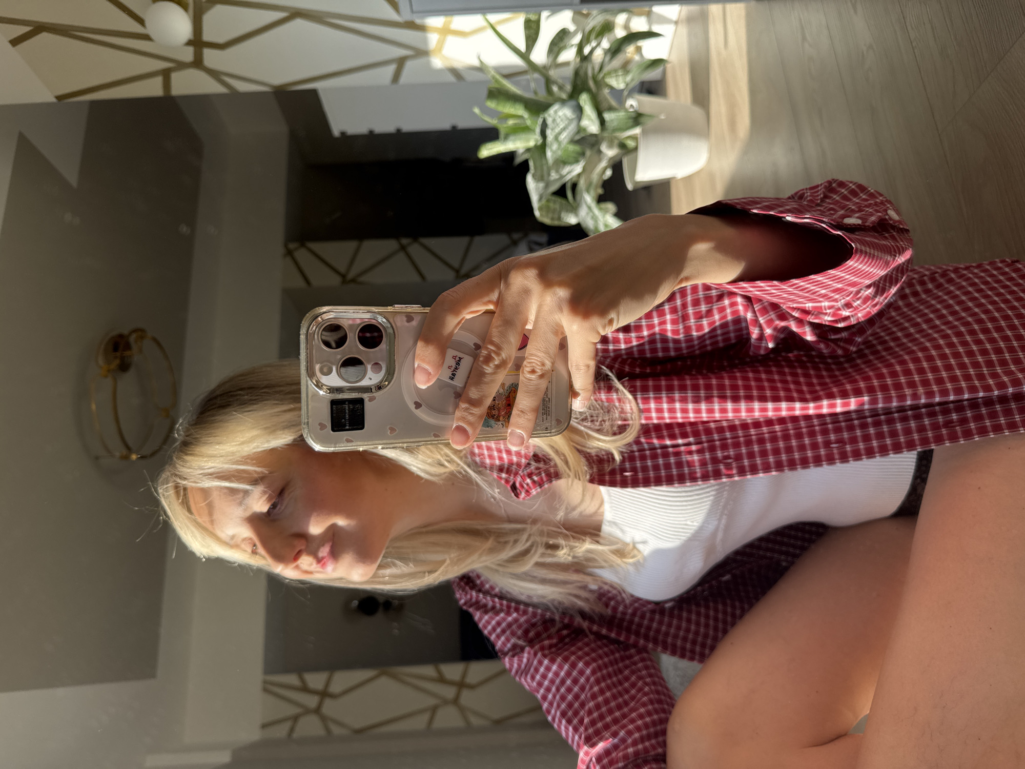 Woman takes morning selfies in Carnikava, Latvia apartment