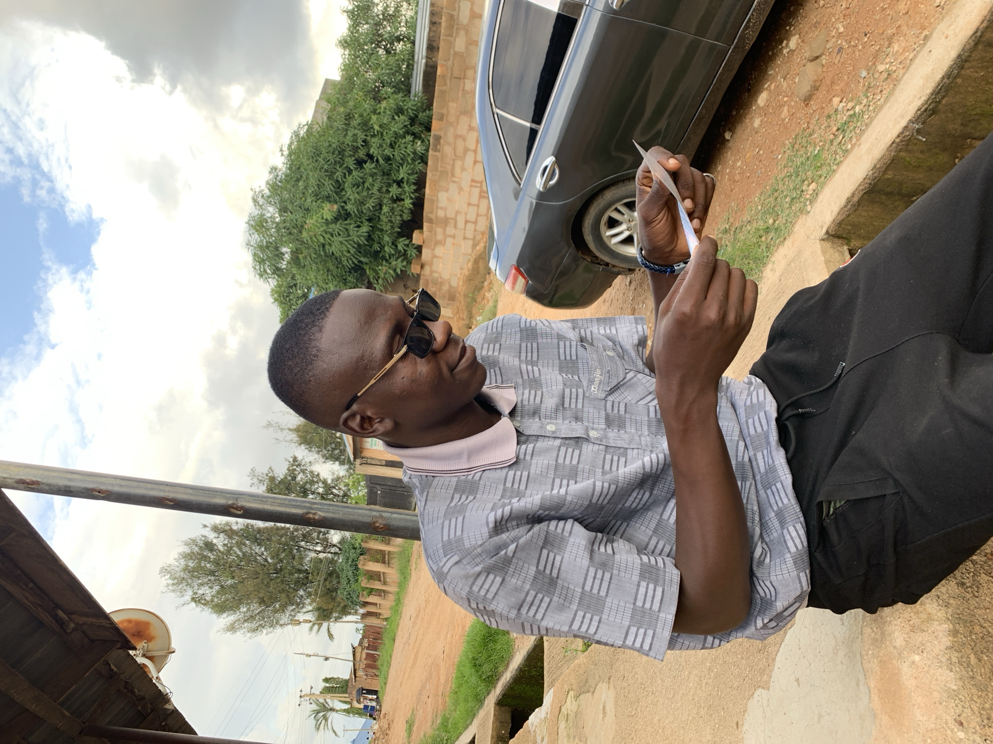Afternoon in Jos, storm clouds building over a quiet neighborhood