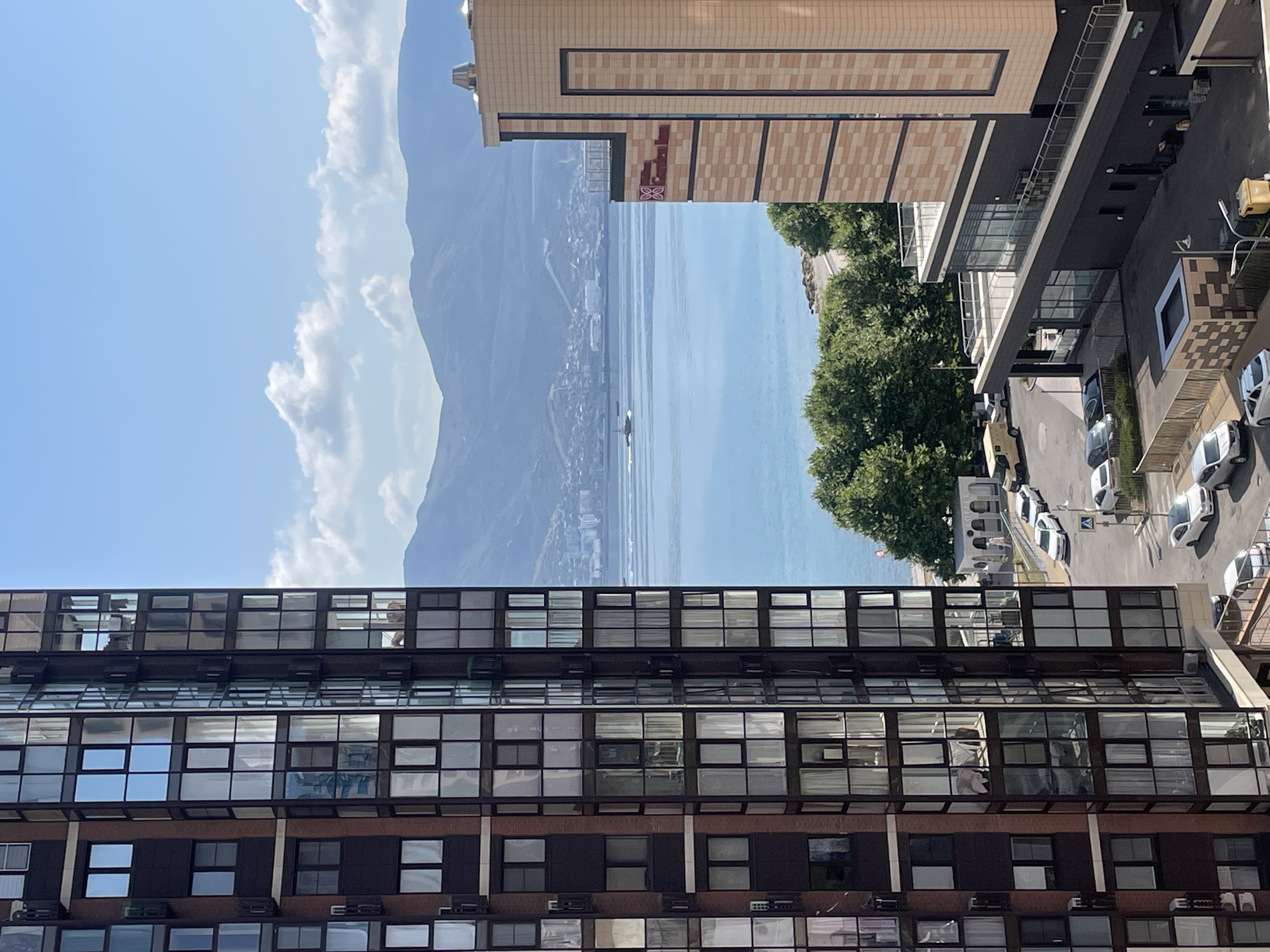 Sunny city morning: waterfront views and outdoor court activity