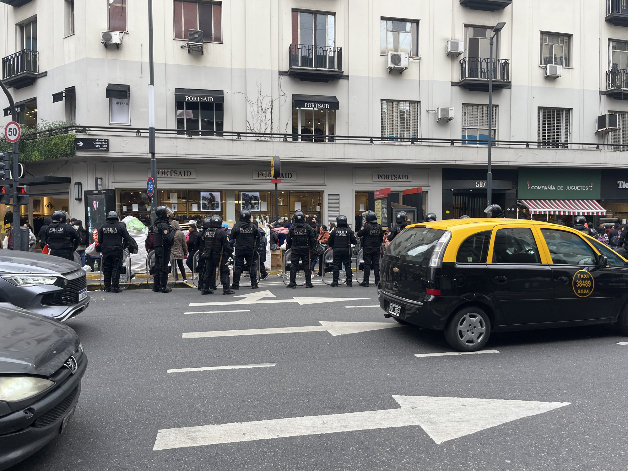 Riot police form line facing crowd in Buenos Aires