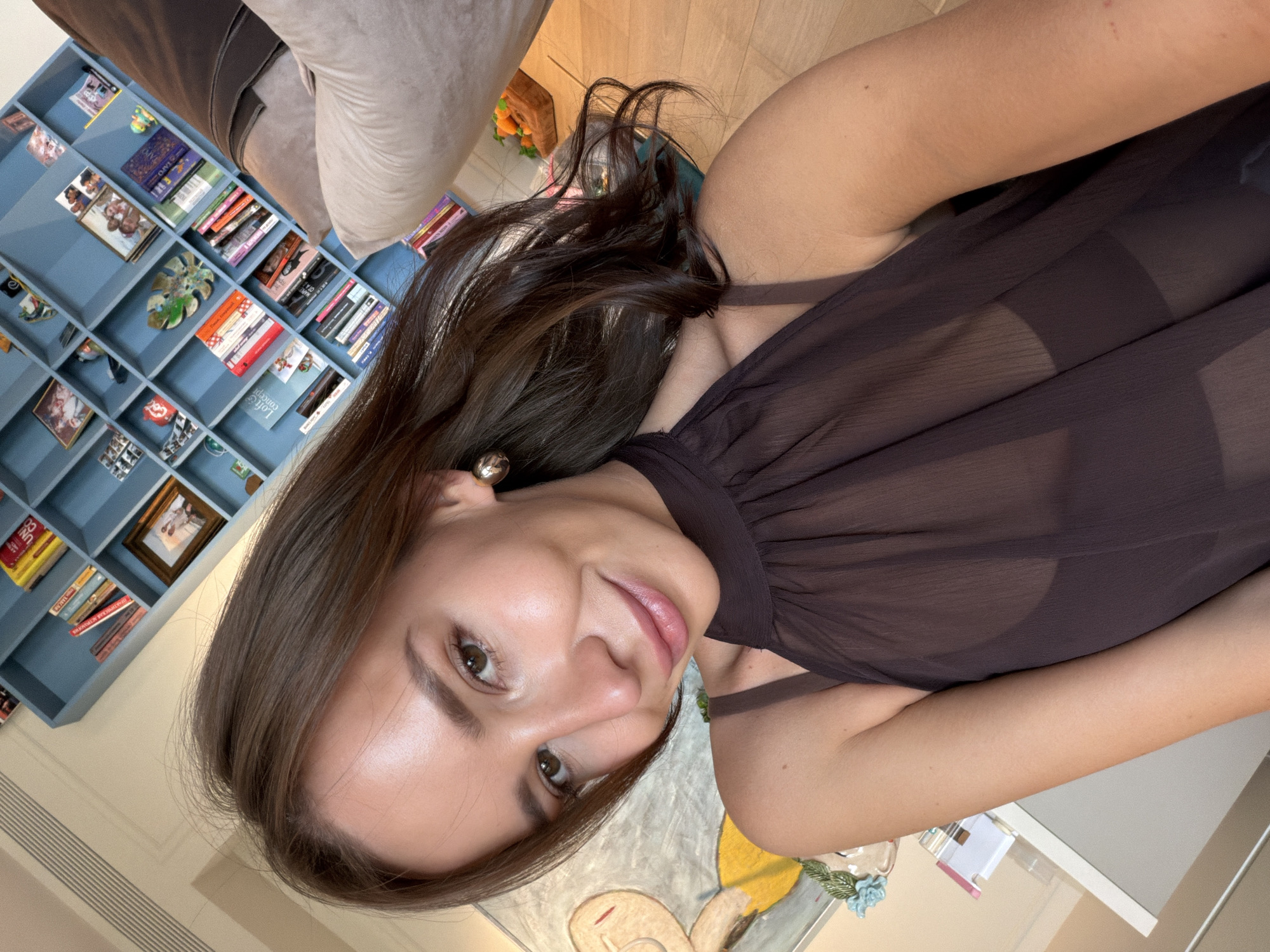 Woman photographed relaxing on couch in Moscow home