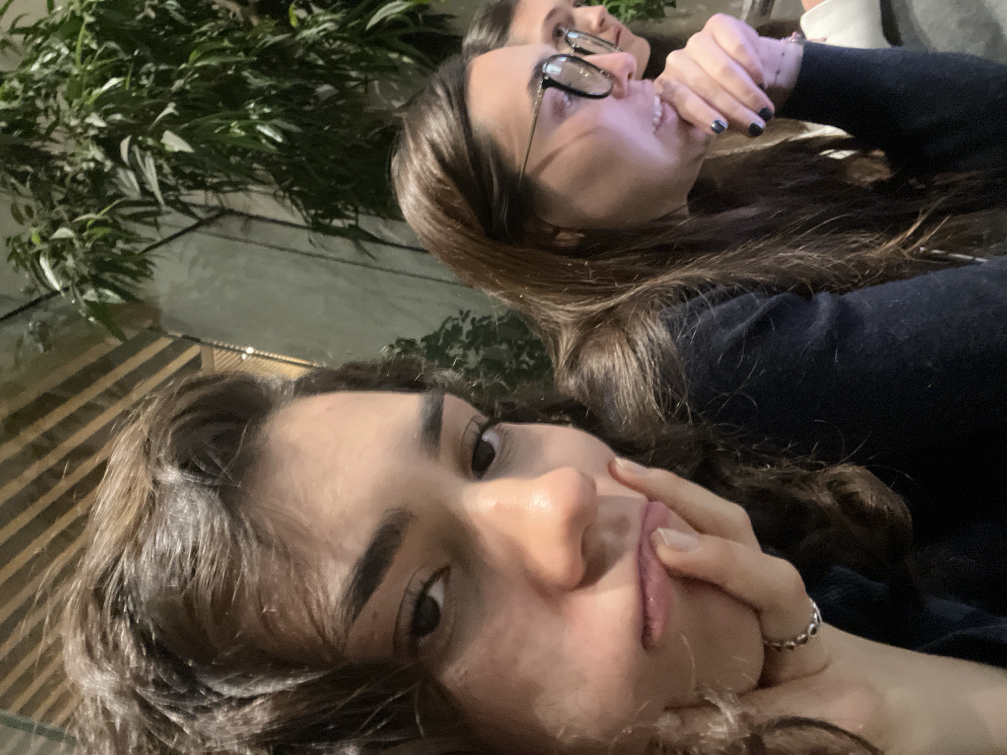 Three women photographed together indoors at night in Mexico City