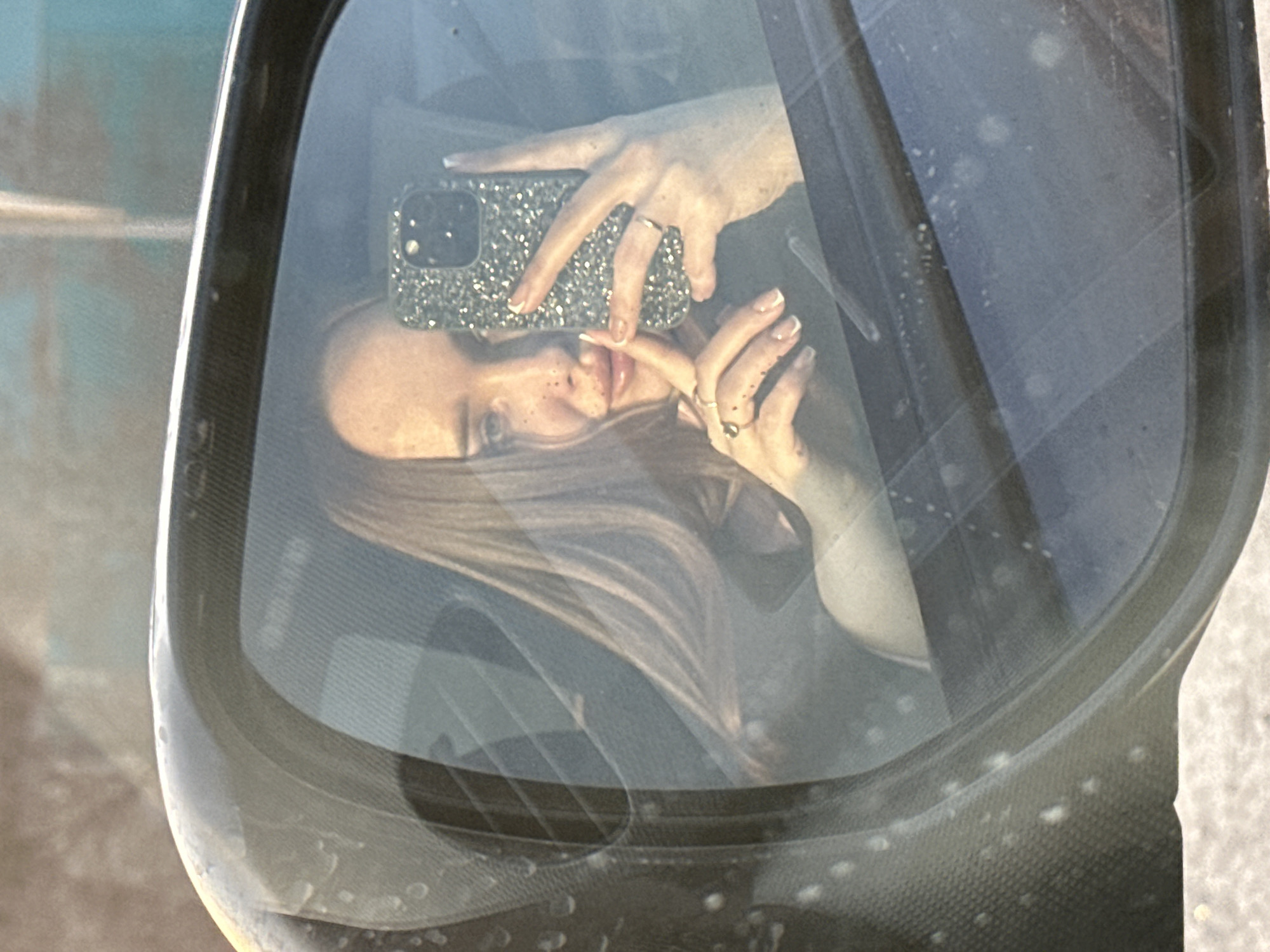 Woman takes selfie in car in Pirogovo, Russia
