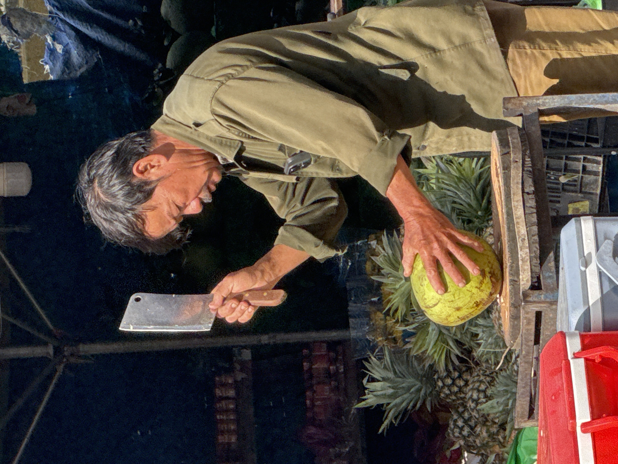 Green coconut vendor at a Da Lat street market