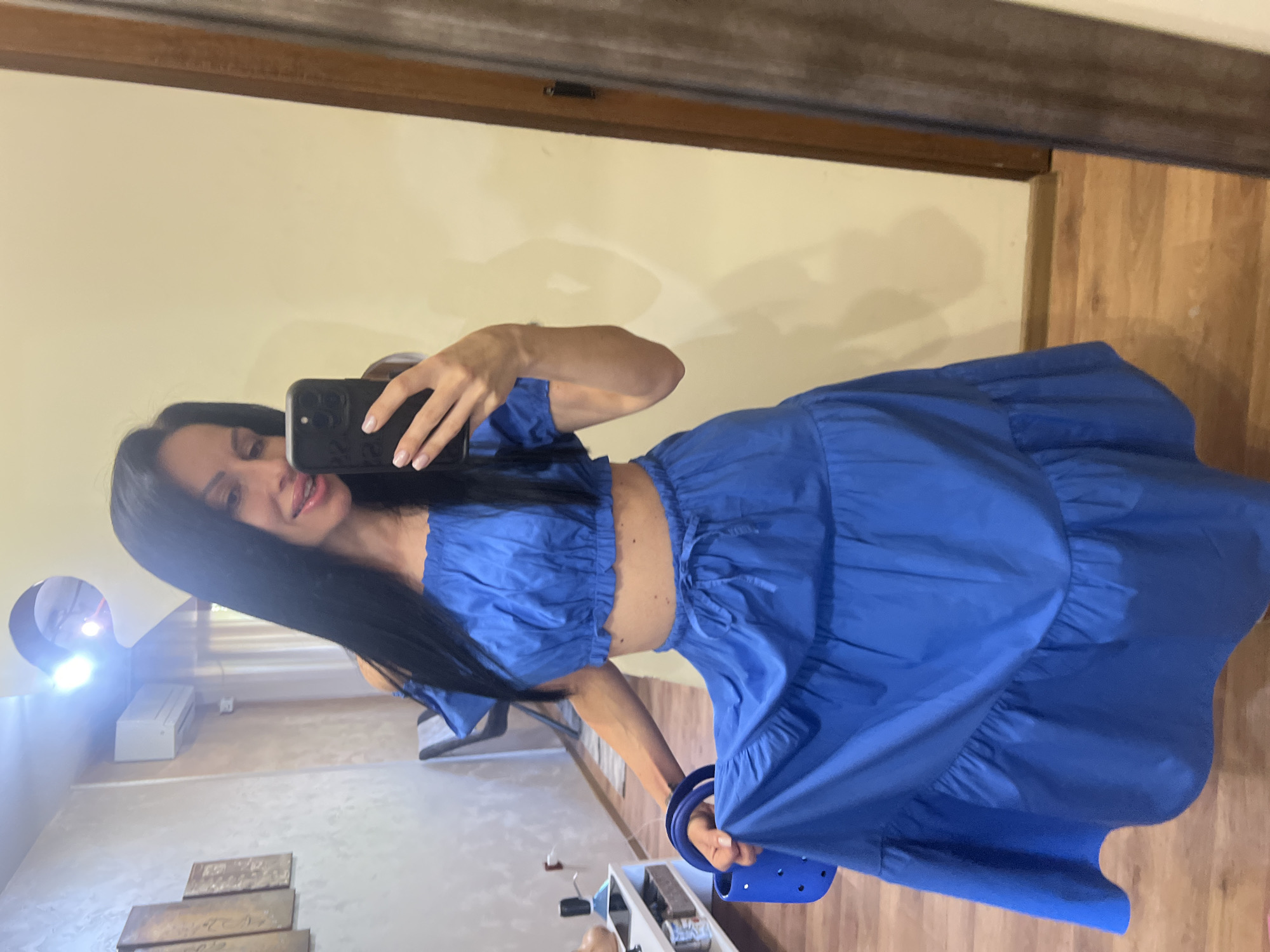 Woman takes mirror selfies in coordinated blue outfit in Bulgaria