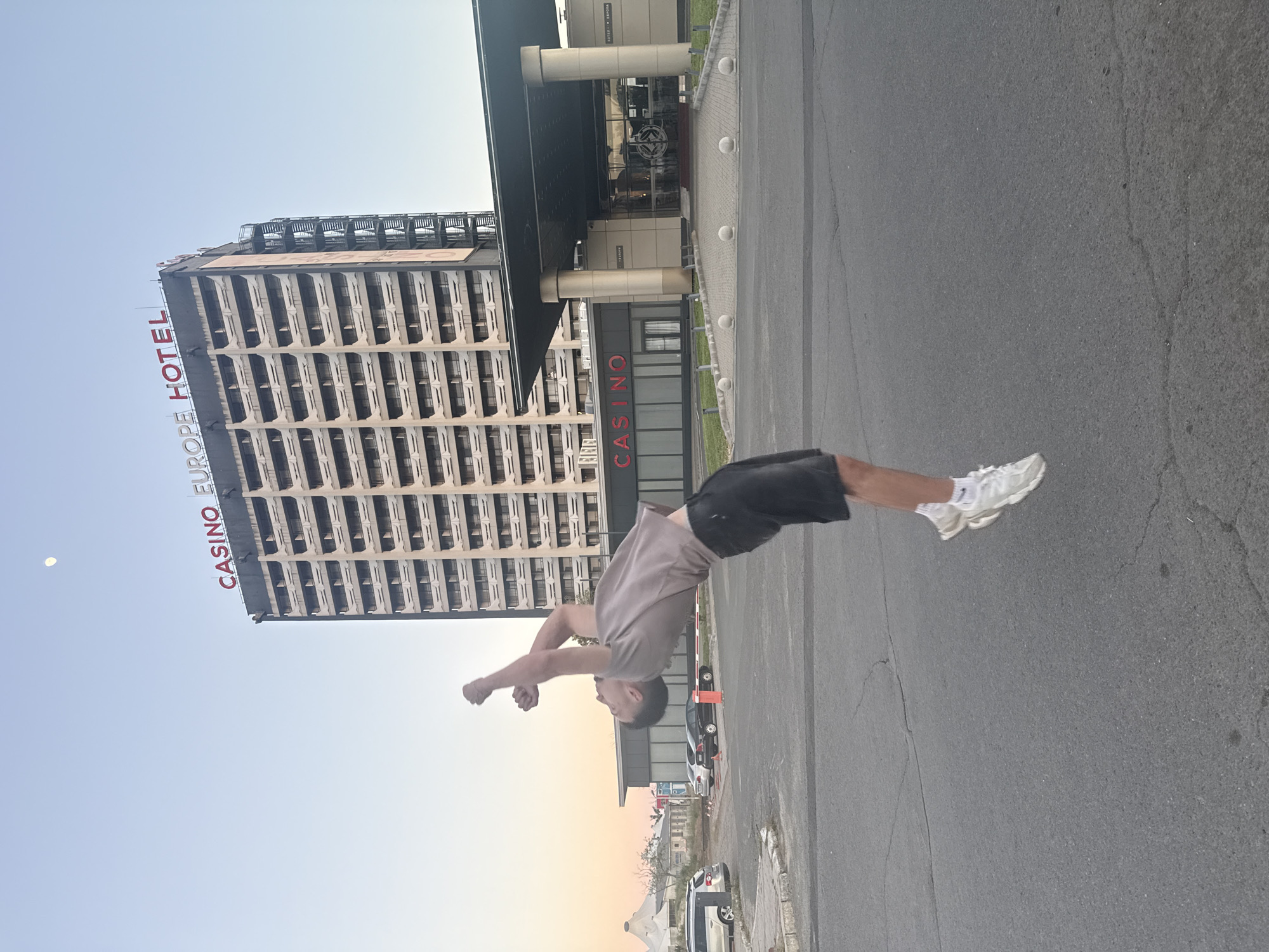 Acrobat performs backflips near Casino Europe Hotel in Nesebar