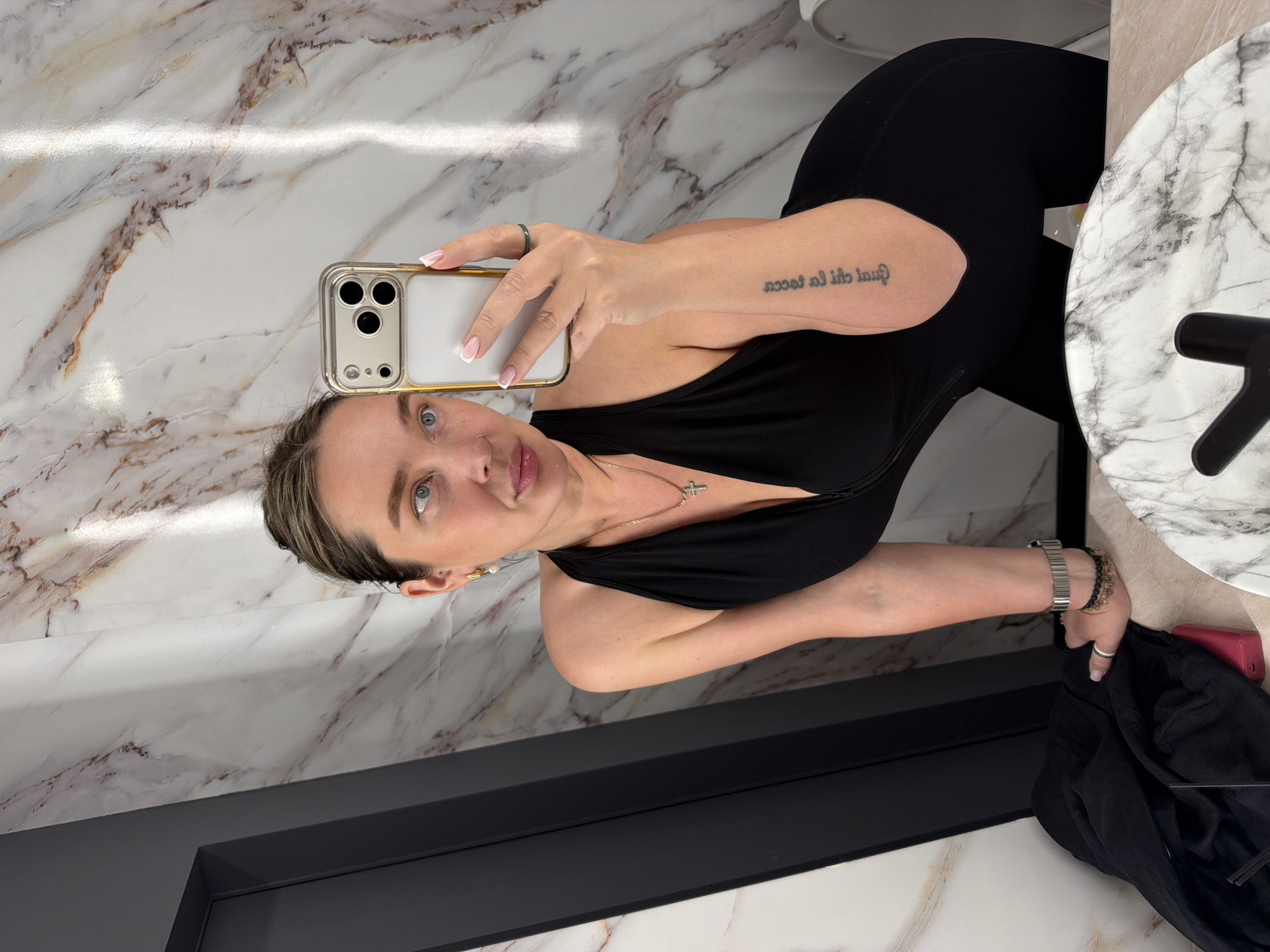 Woman takes bathroom selfies in marble Moscow location